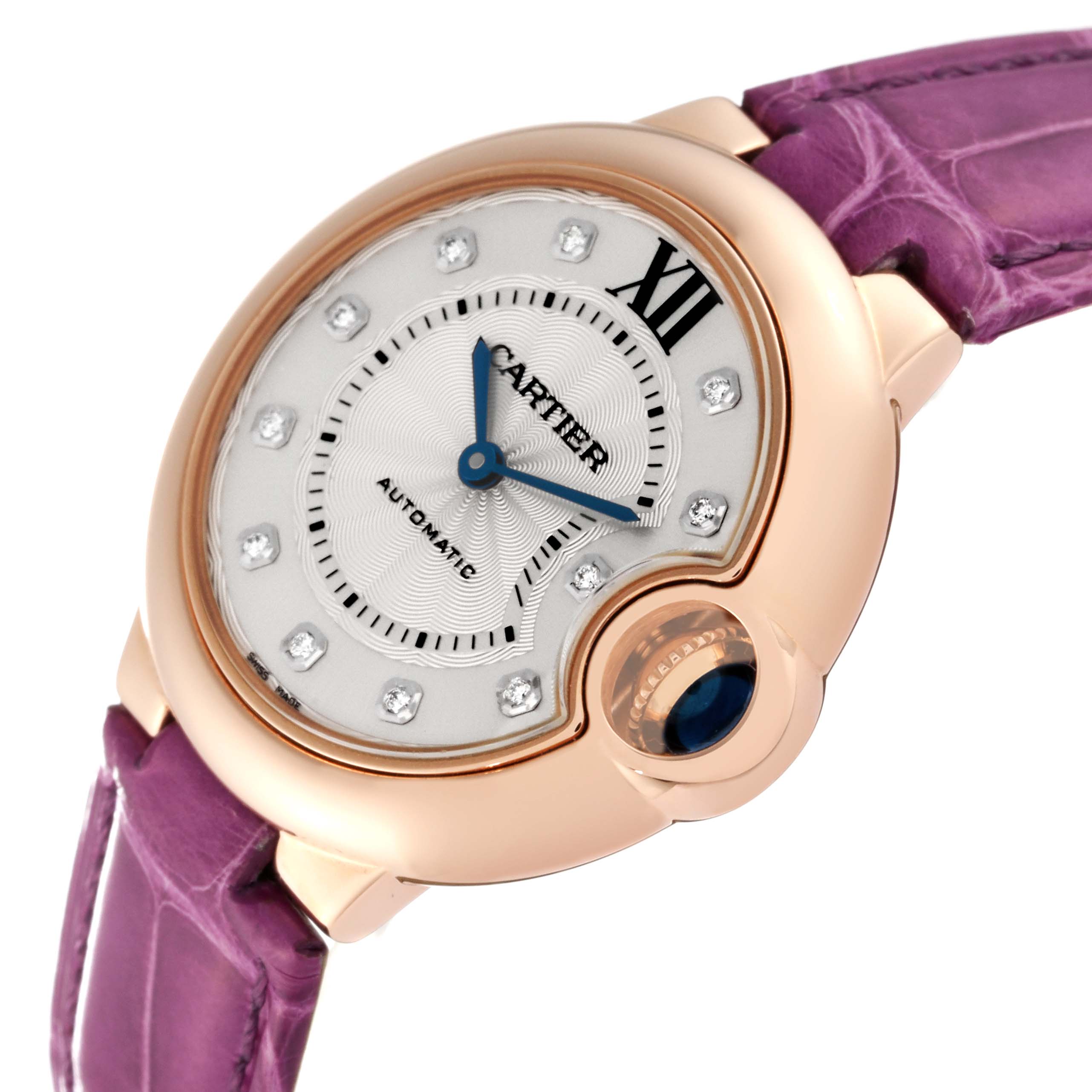 This image shows a close-up of the face and part of the purple strap of a Cartier Ballon Bleu WE902063 Women
s Rose Gold Silver Dial WE902063 Women
s Rose Gold Silver Dial watch.