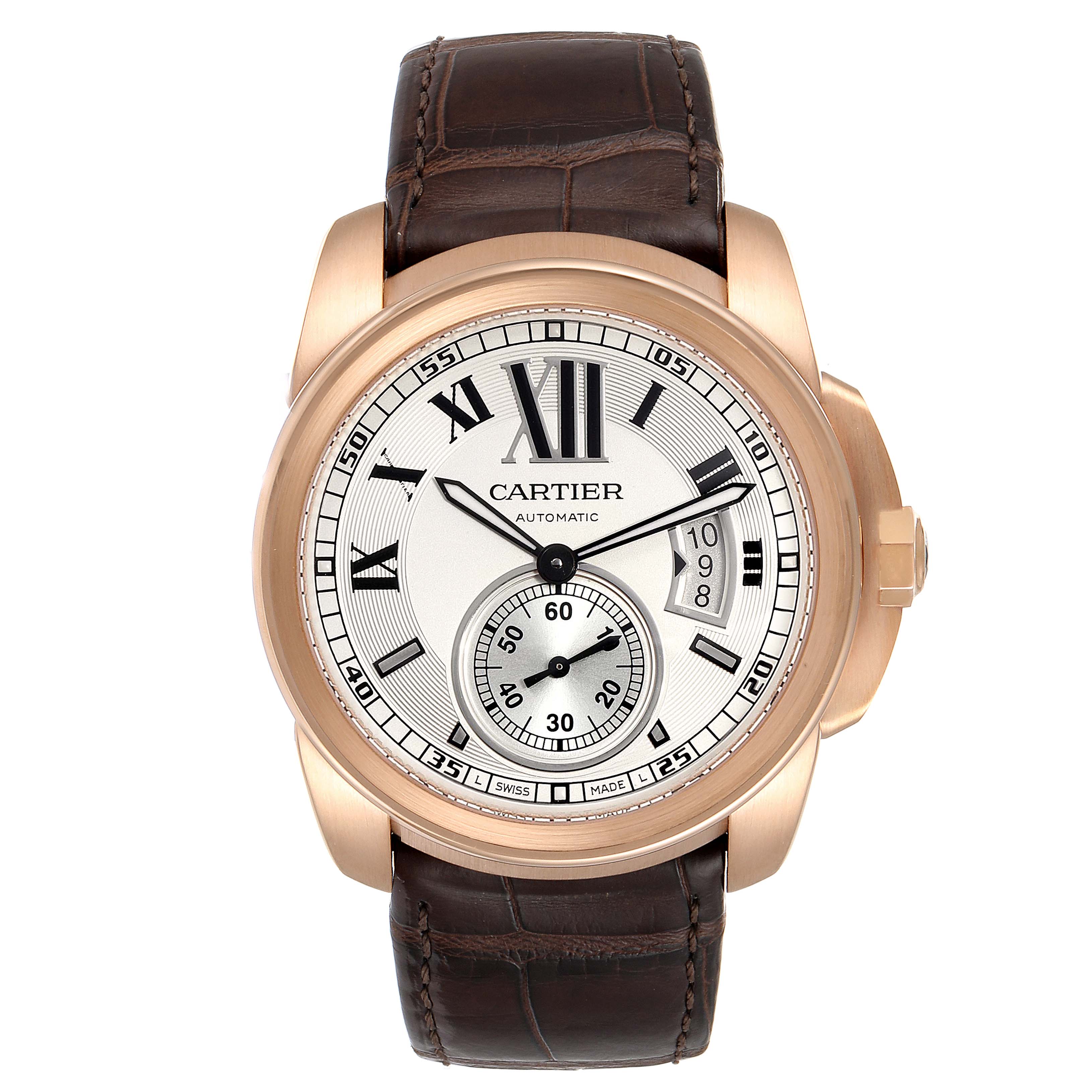 The Calibre de Cartier watch by Cartier is shown from the front, highlighting its dial, case, and brown leather strap.
