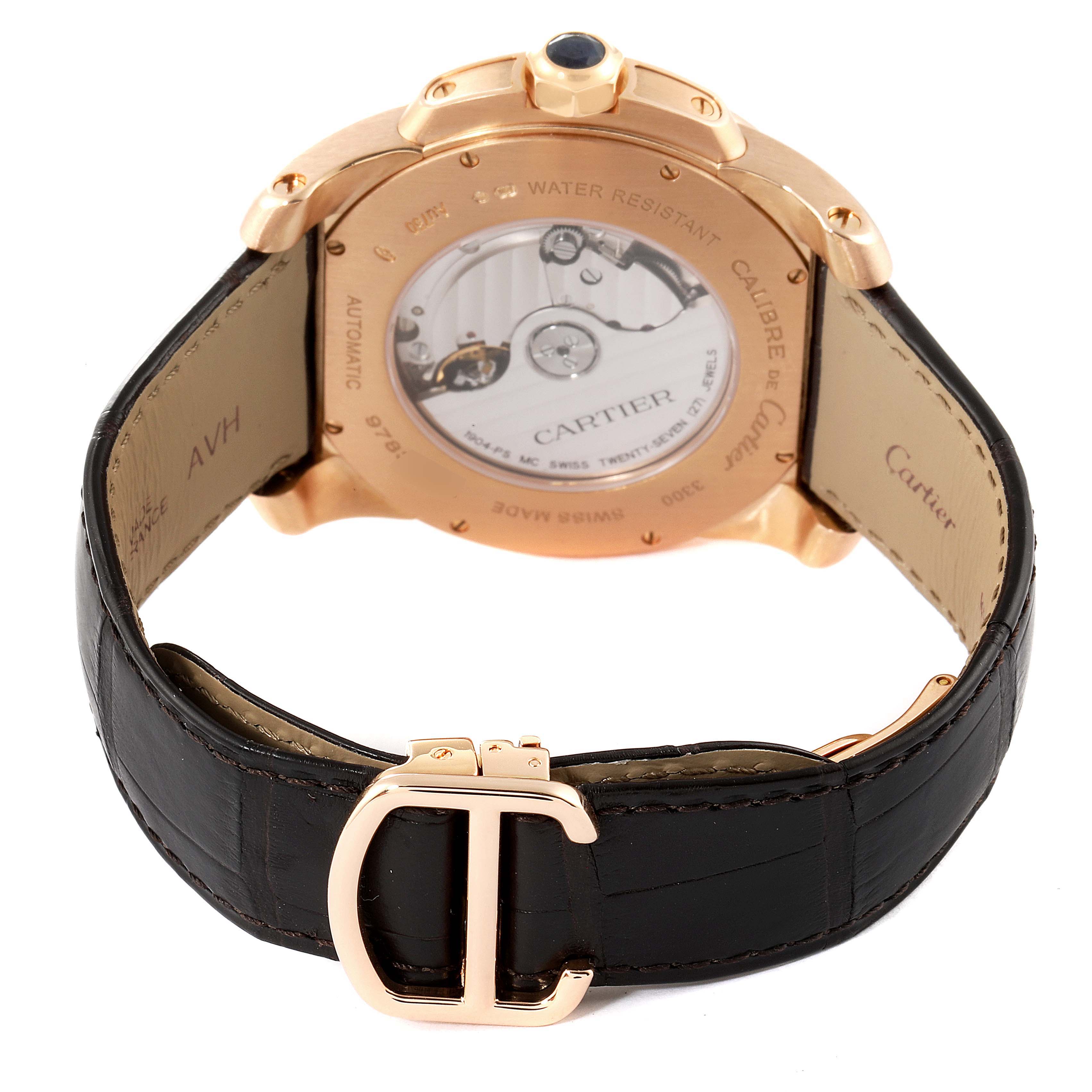 The image shows the back view of a Calibre de Cartier watch by Cartier, highlighting its automatic movement and leather strap.