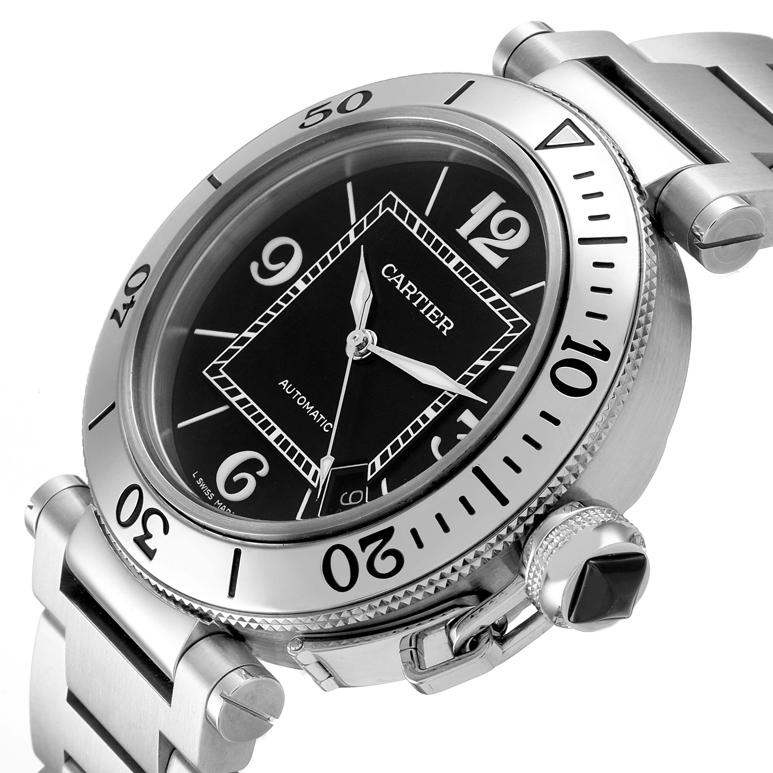 The Cartier Pasha W31080M7 Men's Stainless Steel Black Dial watch is shown at an oblique angle highlighting its bezel, crown, and bracelet links.