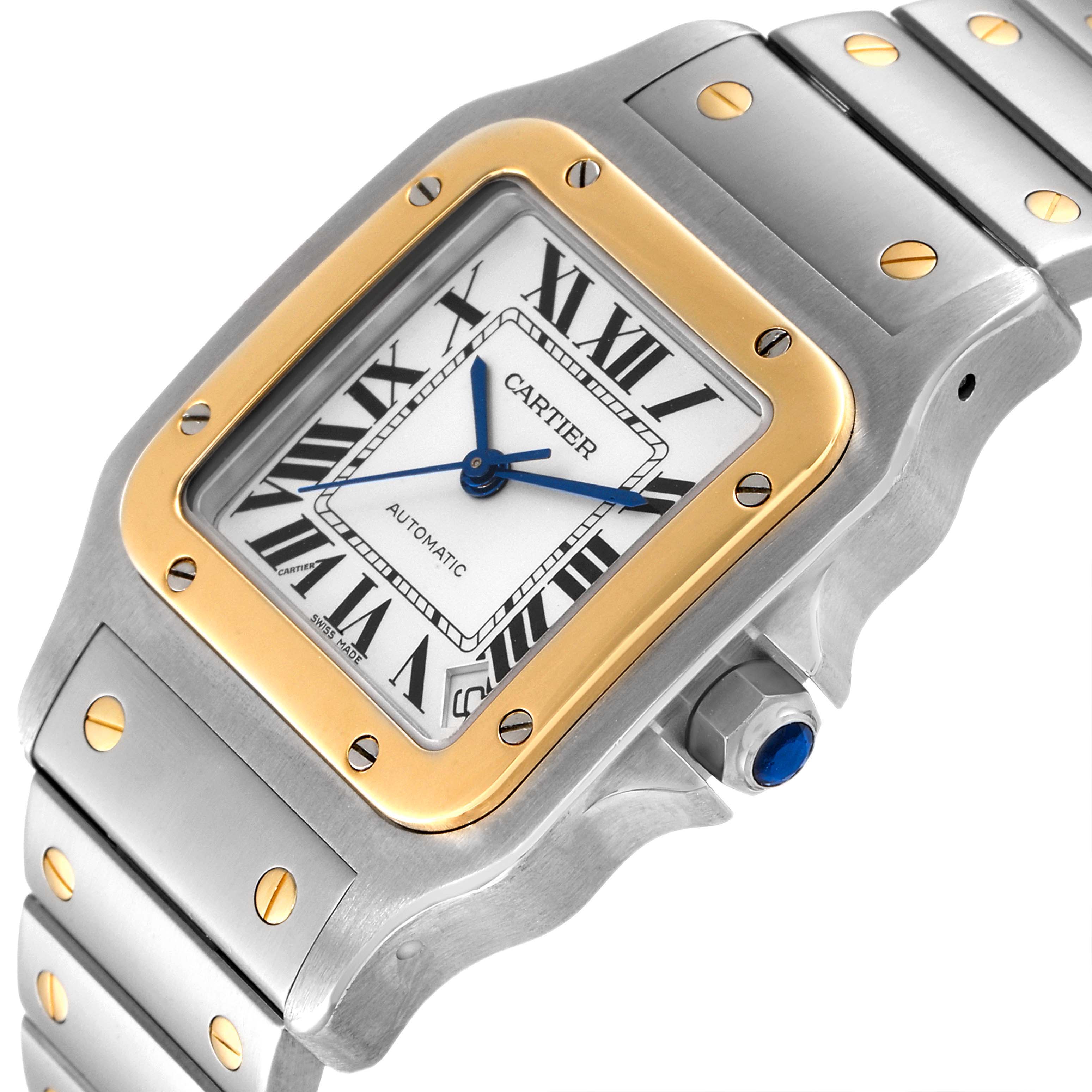 This image shows a close-up of the Cartier Santos W20099C4 Women's Steel and Gold (two tone) Silver Dial W20099C4 Women's Steel and Gold (two tone) Silver Dial watch, highlighting the dial, bezel, crown, and part of the bracelet.