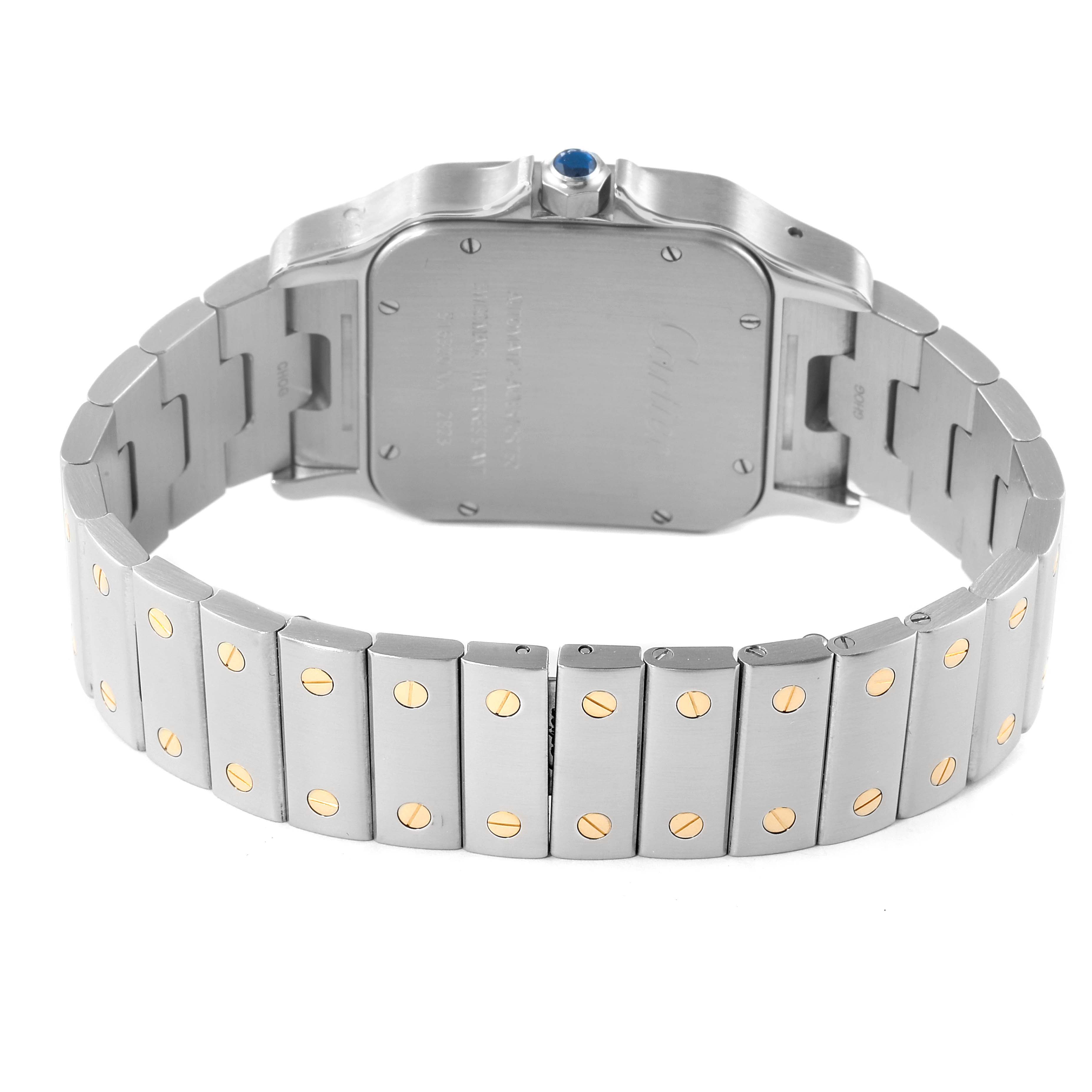 The image shows the back of the Cartier Santos W20099C4 Women's Steel and Gold (two tone) Silver Dial W20099C4 Women's Steel and Gold (two tone) Silver Dial watch, highlighting its case back and metal bracelet with gold screw accents.