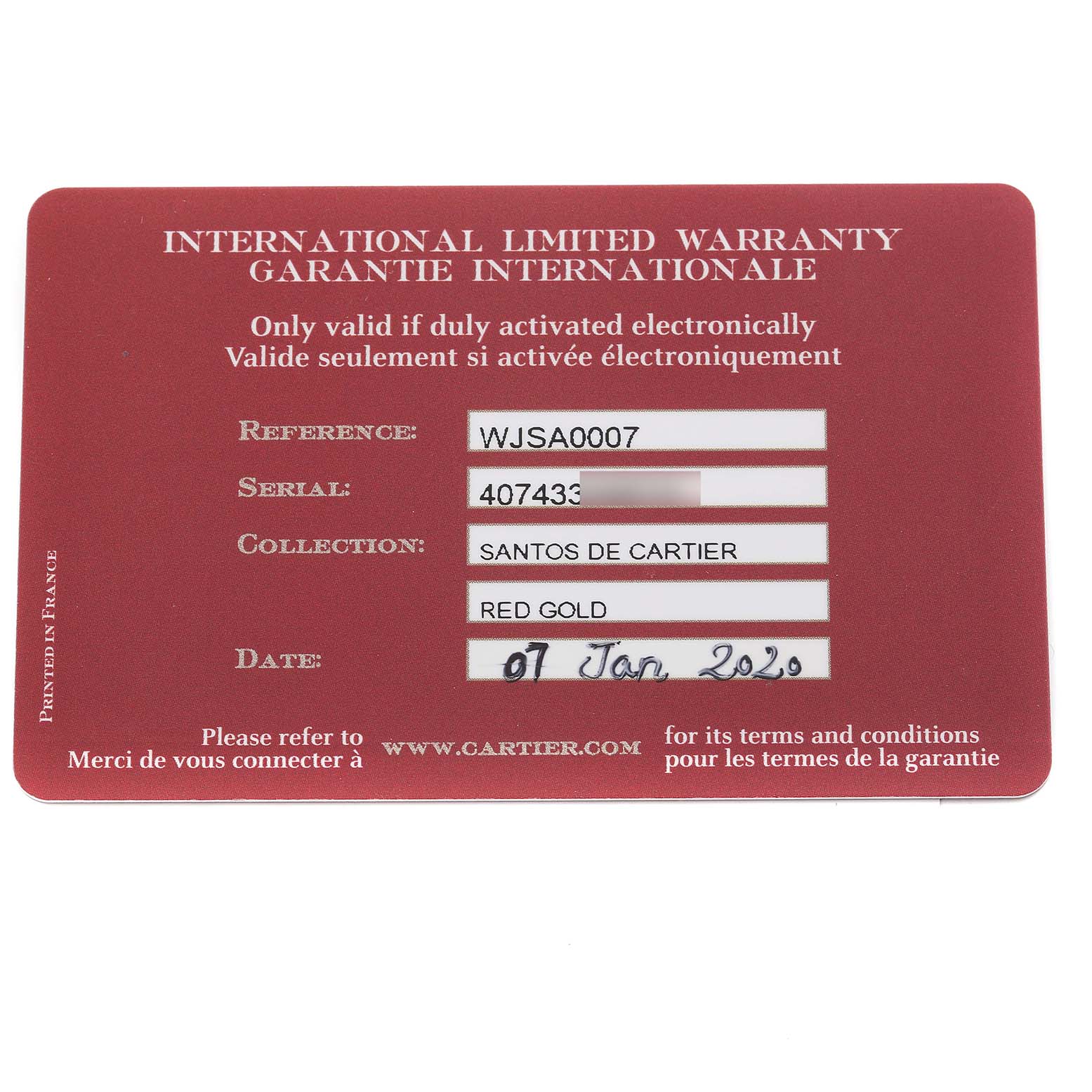 The image shows a Cartier Santos WJSA0007 Men
s Rose Gold Silver Dial WJSA0007 Men
s Rose Gold Silver Dial model international limited warranty card from a top-down angle.