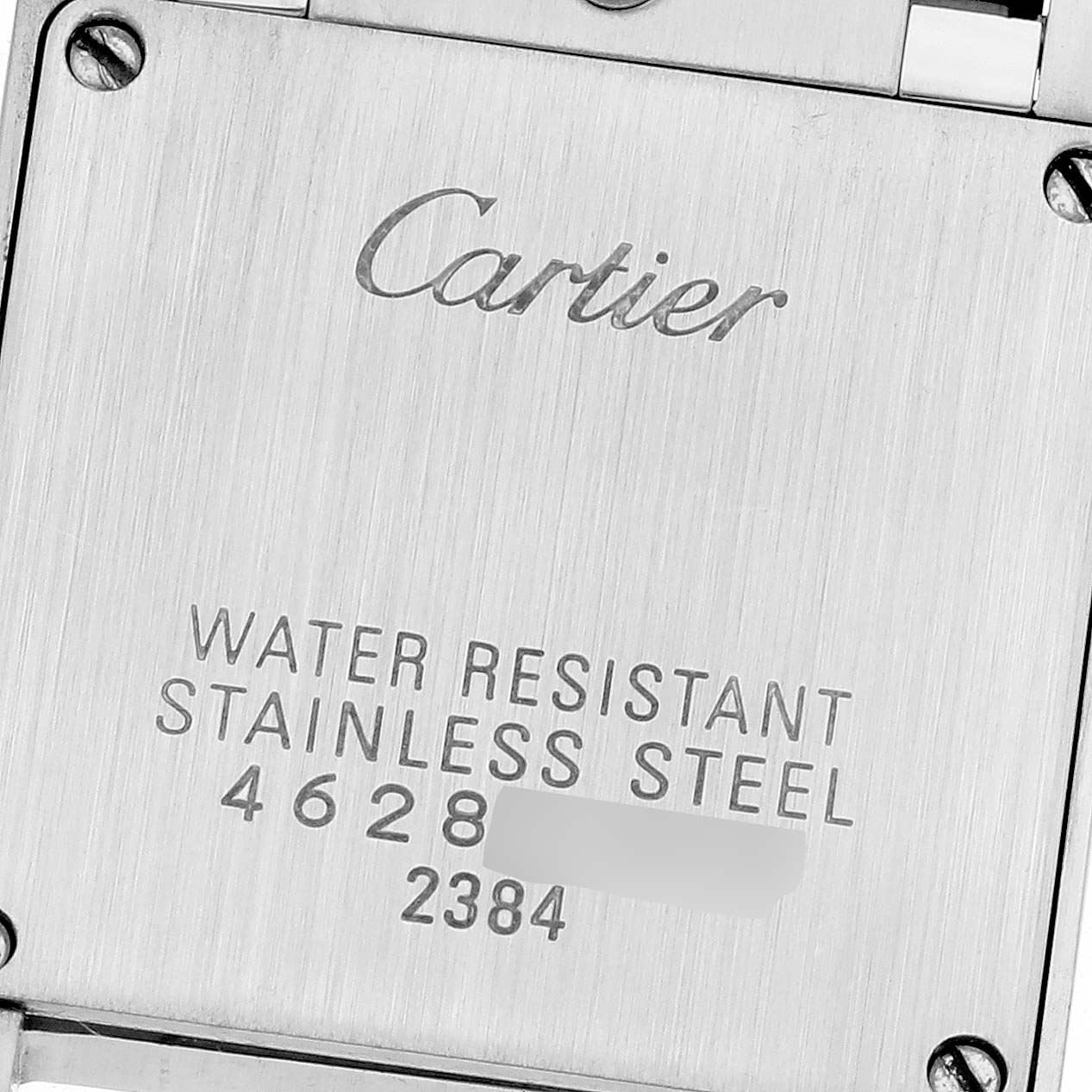 The image shows the back casing of a Cartier Tank Francaise W51008Q3 Women's Stainless Steel Silver Dial W51008Q3 Women's Stainless Steel Silver Dial watch with engraved details about water resistance and material.
