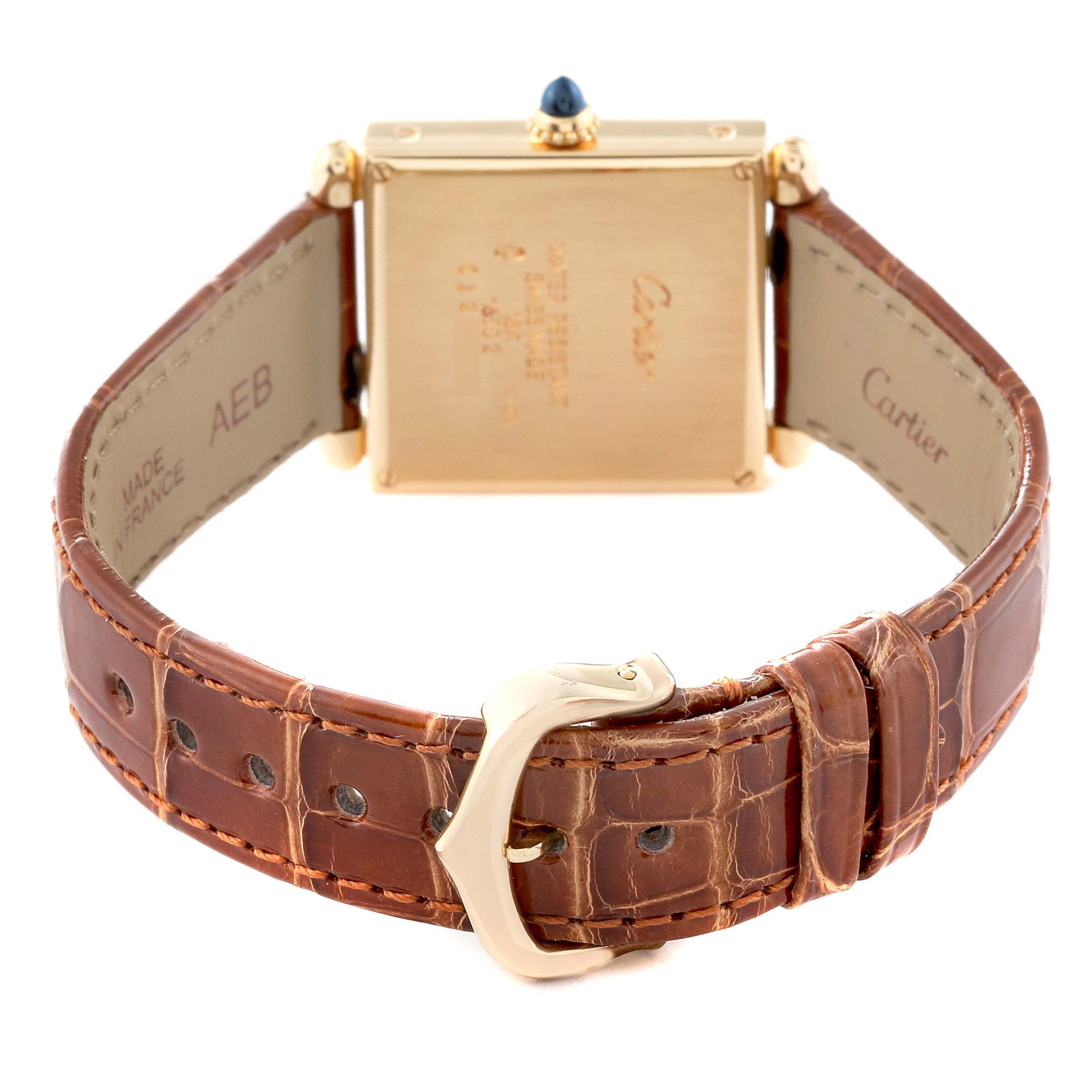 The image shows the back case and strap of a Cartier Tank Obus W1512256 Women's Yellow Gold Silver Dial W1512256 Women's Yellow Gold Silver Dial watch, focusing on the buckle and leather detail.