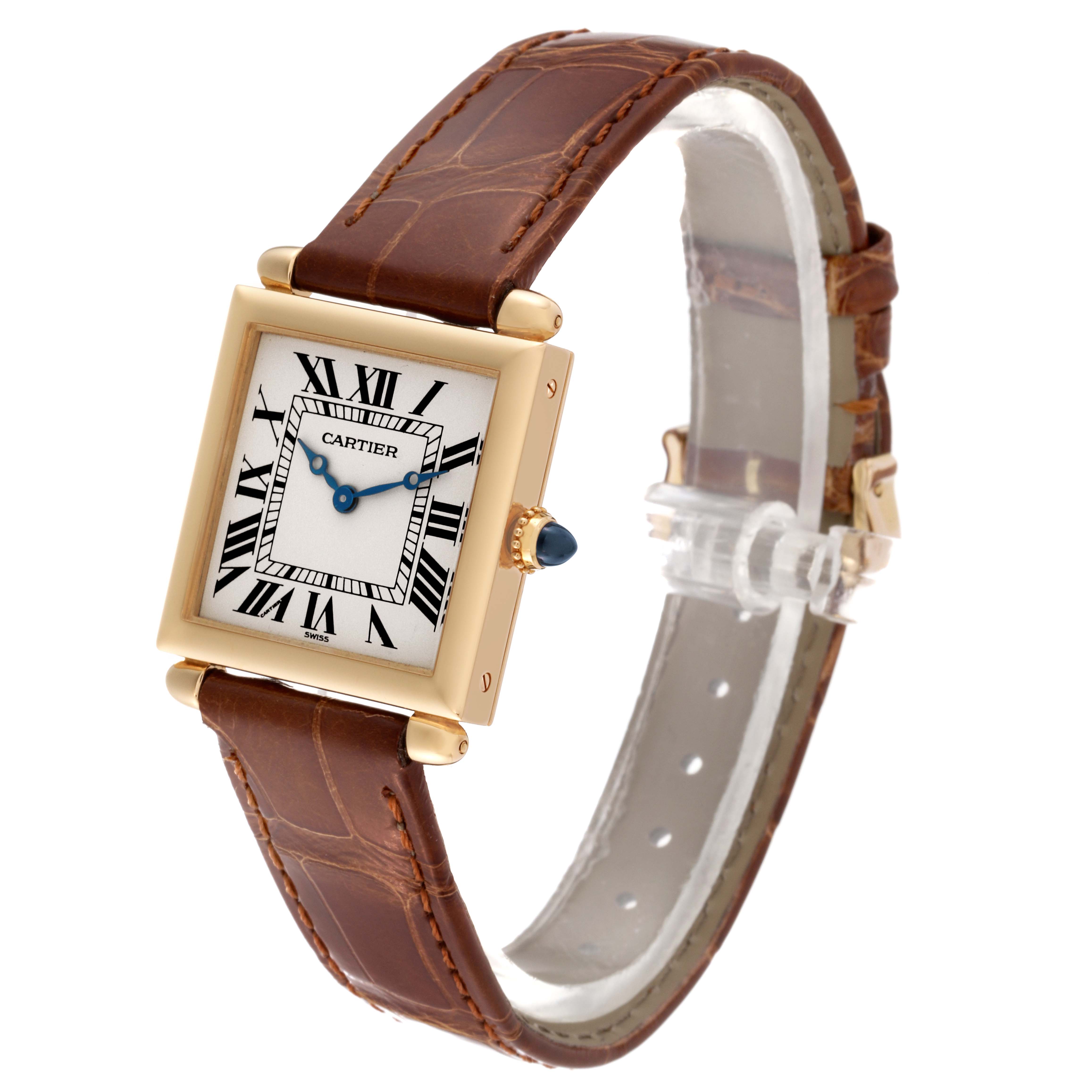 This Cartier Tank Obus W1512256 Women's Yellow Gold Silver Dial W1512256 Women's Yellow Gold Silver Dial model watch is shown at a side angle, displaying its square face, roman numerals, and brown leather strap.