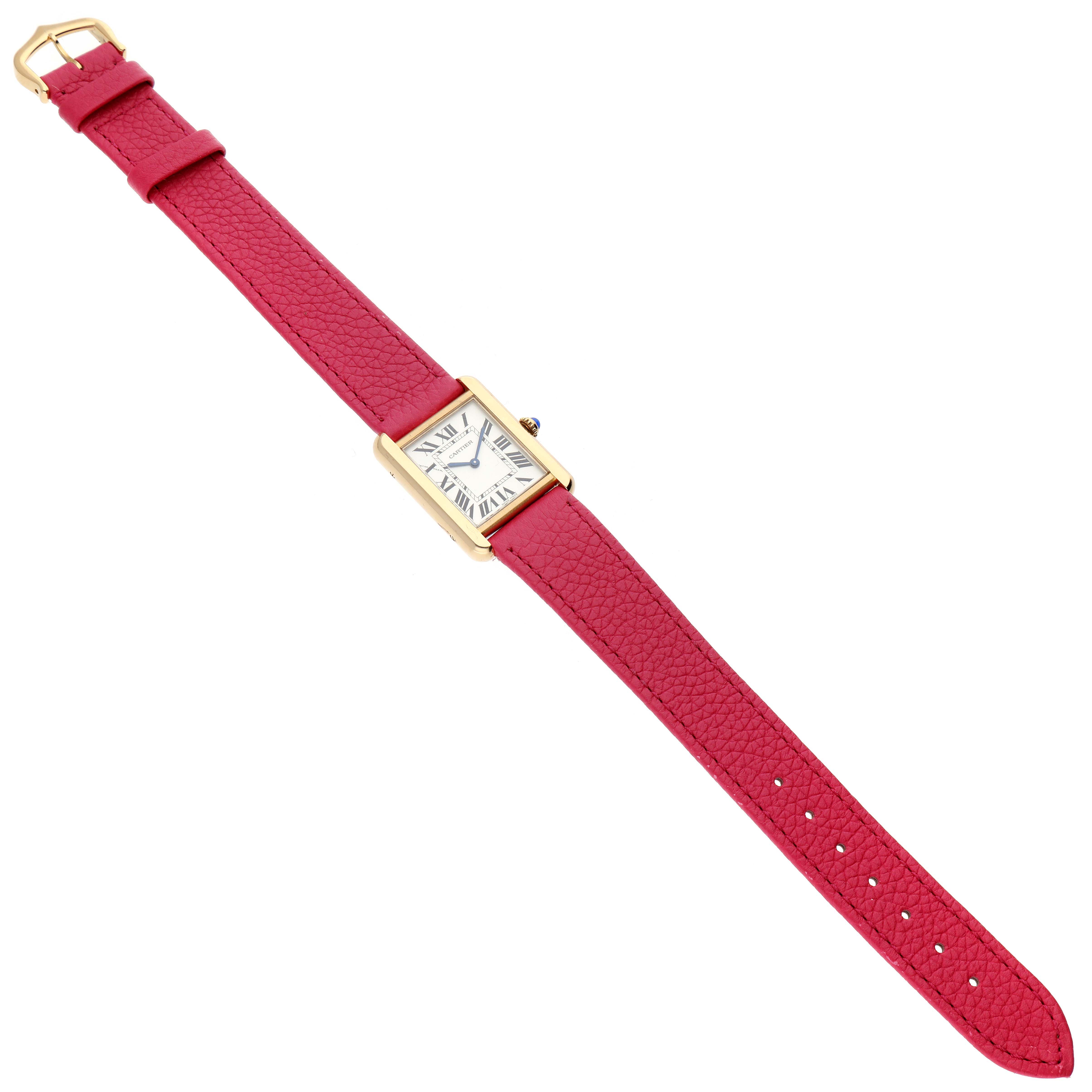 The image shows a Cartier Tank Solo W5200002 Women
s Steel and Gold (two tone) Silver Dial W5200002 Women
s Steel and Gold (two tone) Silver Dial watch, viewed from the top, featuring a rectangular face and a pink leather strap.