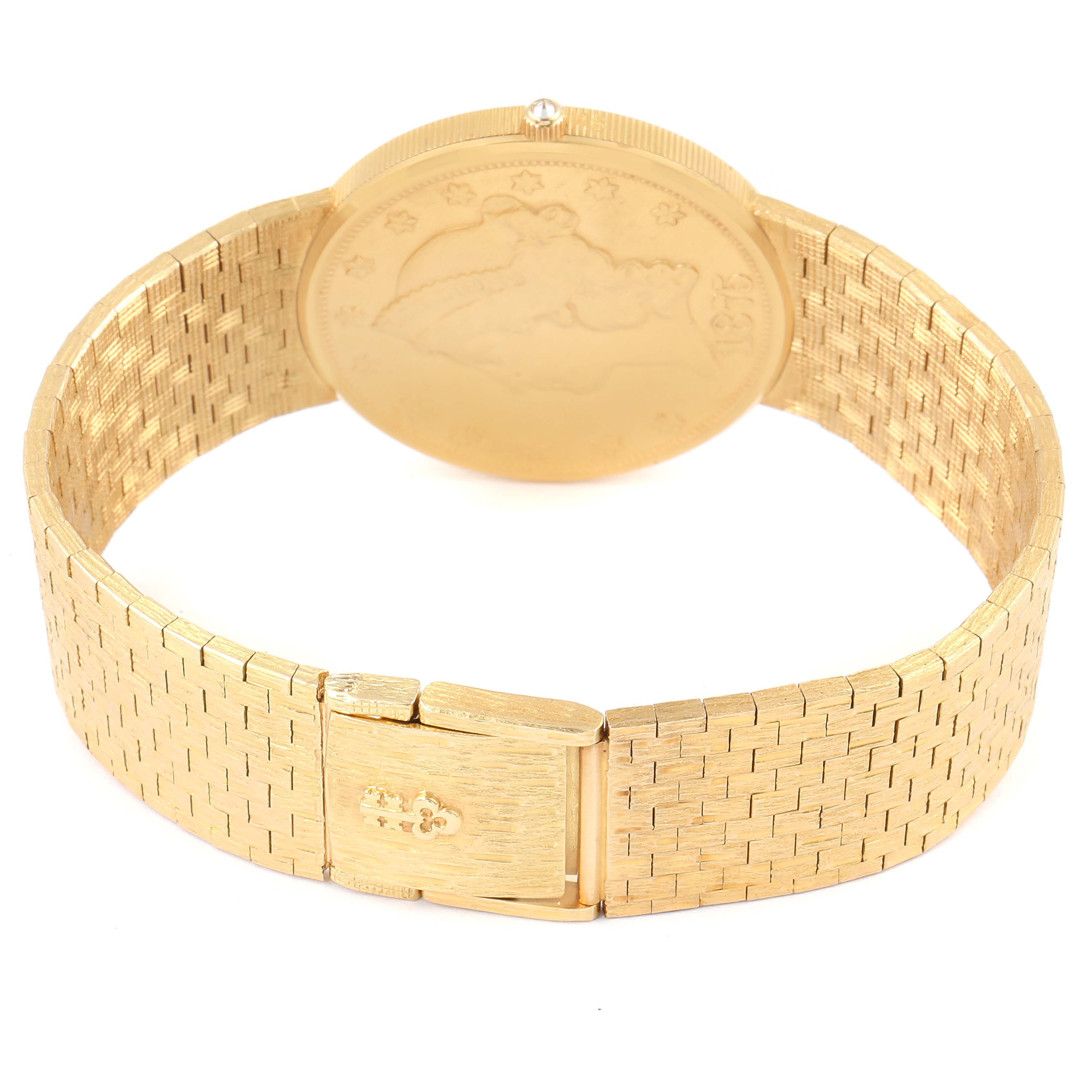 The image shows a Corum Coin Watch 1875  Men's Yellow Gold Black Dial 1875  Men's Yellow Gold Black Dial model viewed from the back, highlighting the clasp and band design.