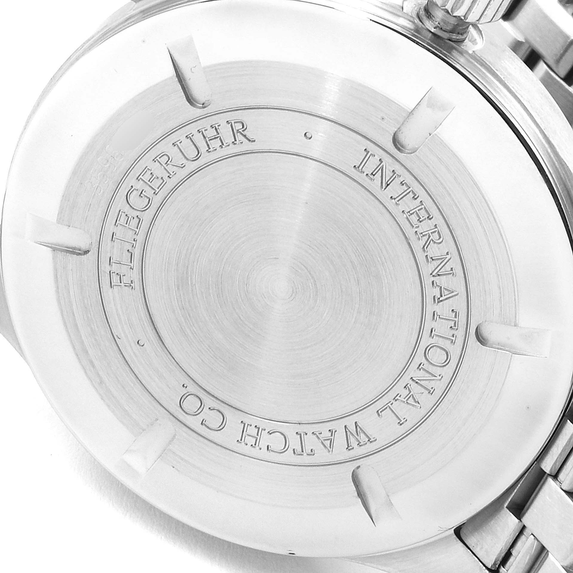 This image shows the back case of an IWC Pilot IW325504 Men's Stainless Steel Black Dial IW325504 Men's Stainless Steel Black Dial model watch, displaying the branding and some engraving details.