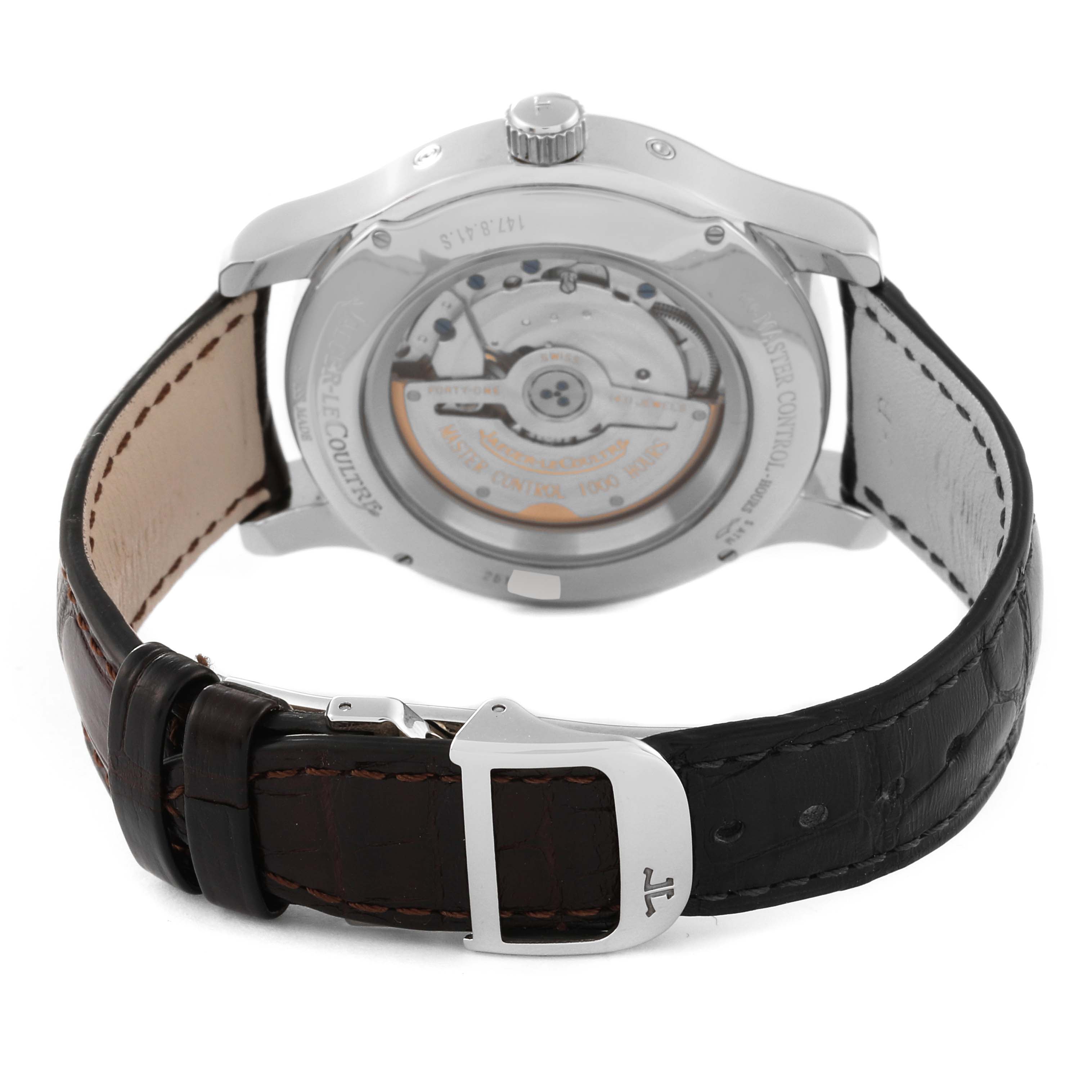 The image shows the back view of the Jaeger-LeCoultre Master watch, highlighting its movement through the transparent case back and the leather strap.
