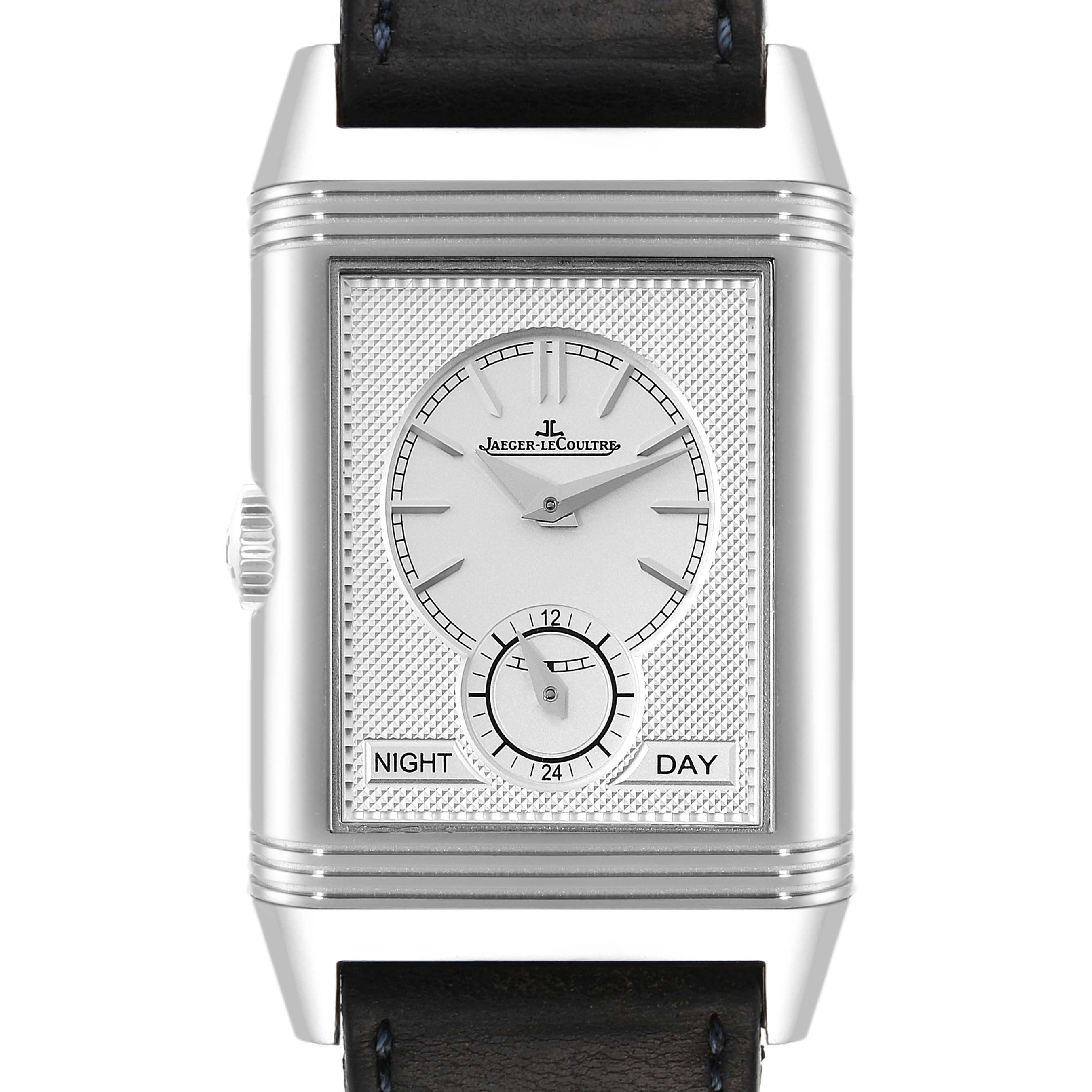 The image shows a front view of a Jaeger-LeCoultre Reverso watch, highlighting its dial, day/night indicator, and strap.