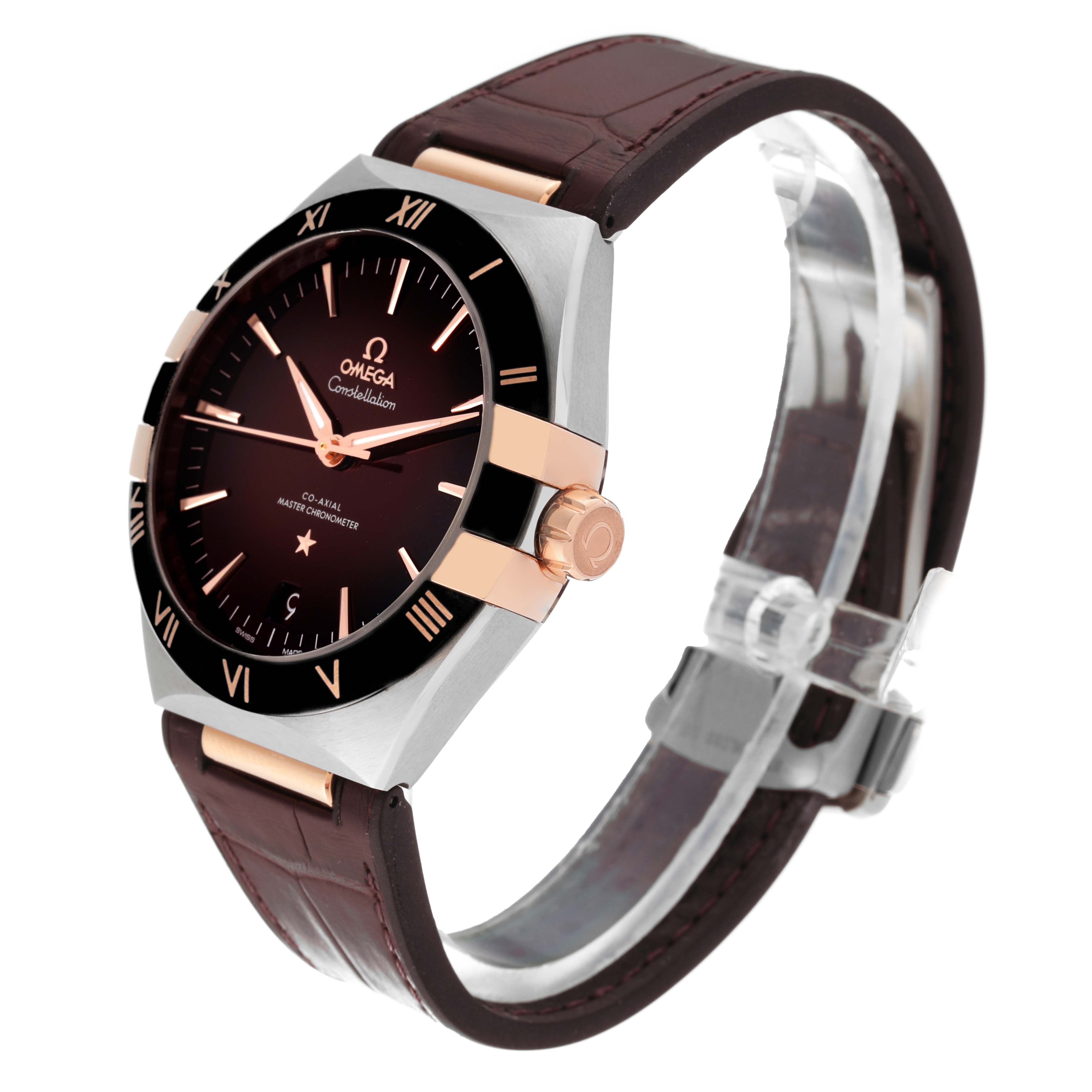 The Omega Constellation 131.23.41.21.11.001 Men
s Steel and Gold (two tone) Red Dial 131.23.41.21.11.001 Men
s Steel and Gold (two tone) Red Dial watch is shown from an angled front view, highlighting its dial, bezel, case, and leather strap.