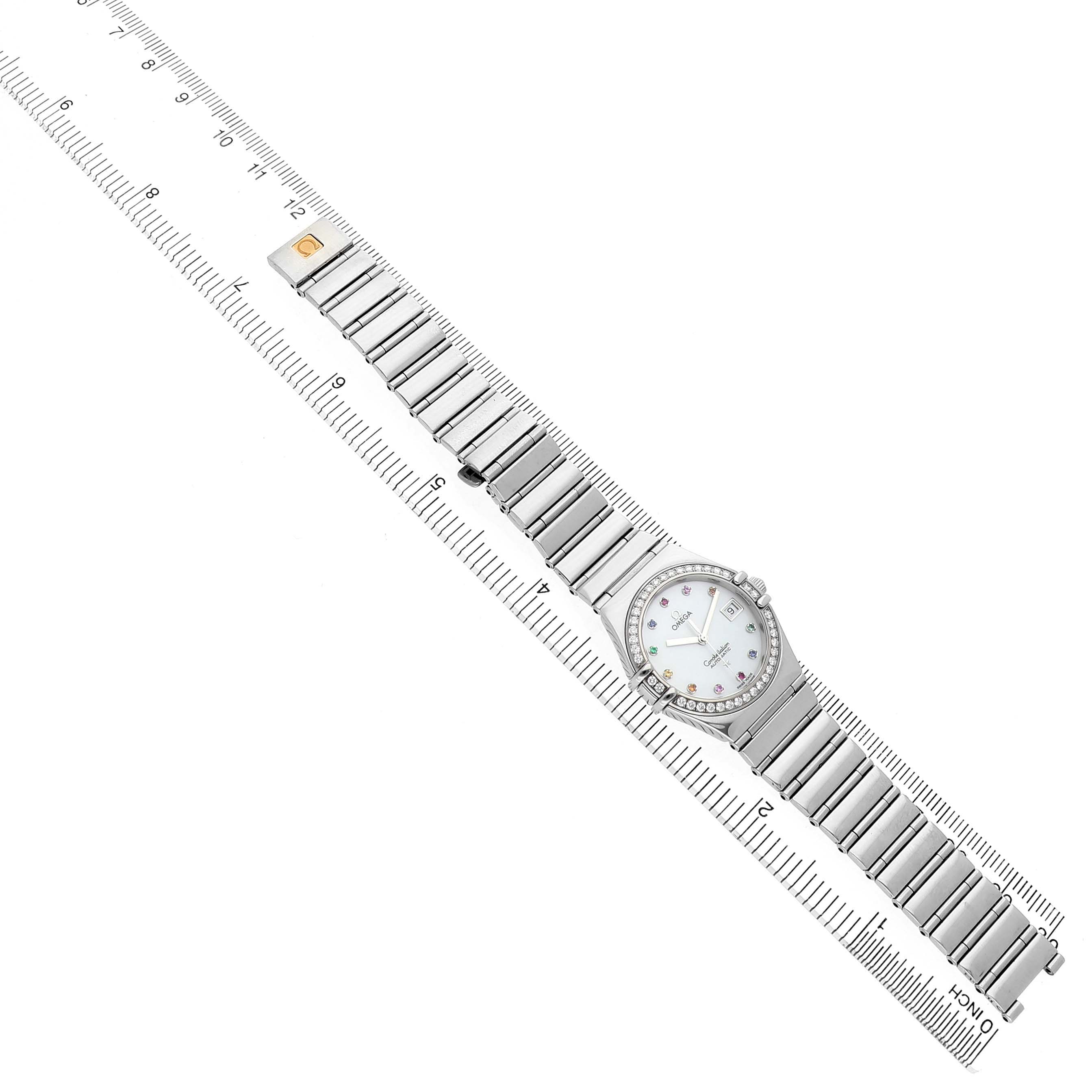 The Omega 1495.79.00 Women's Stainless Steel Mother of Pearl Dial Constellation Steel Multi Stone MOP Diamond Watch 1495.79.00 is shown from a top-down angle, displaying the entire bracelet and face.