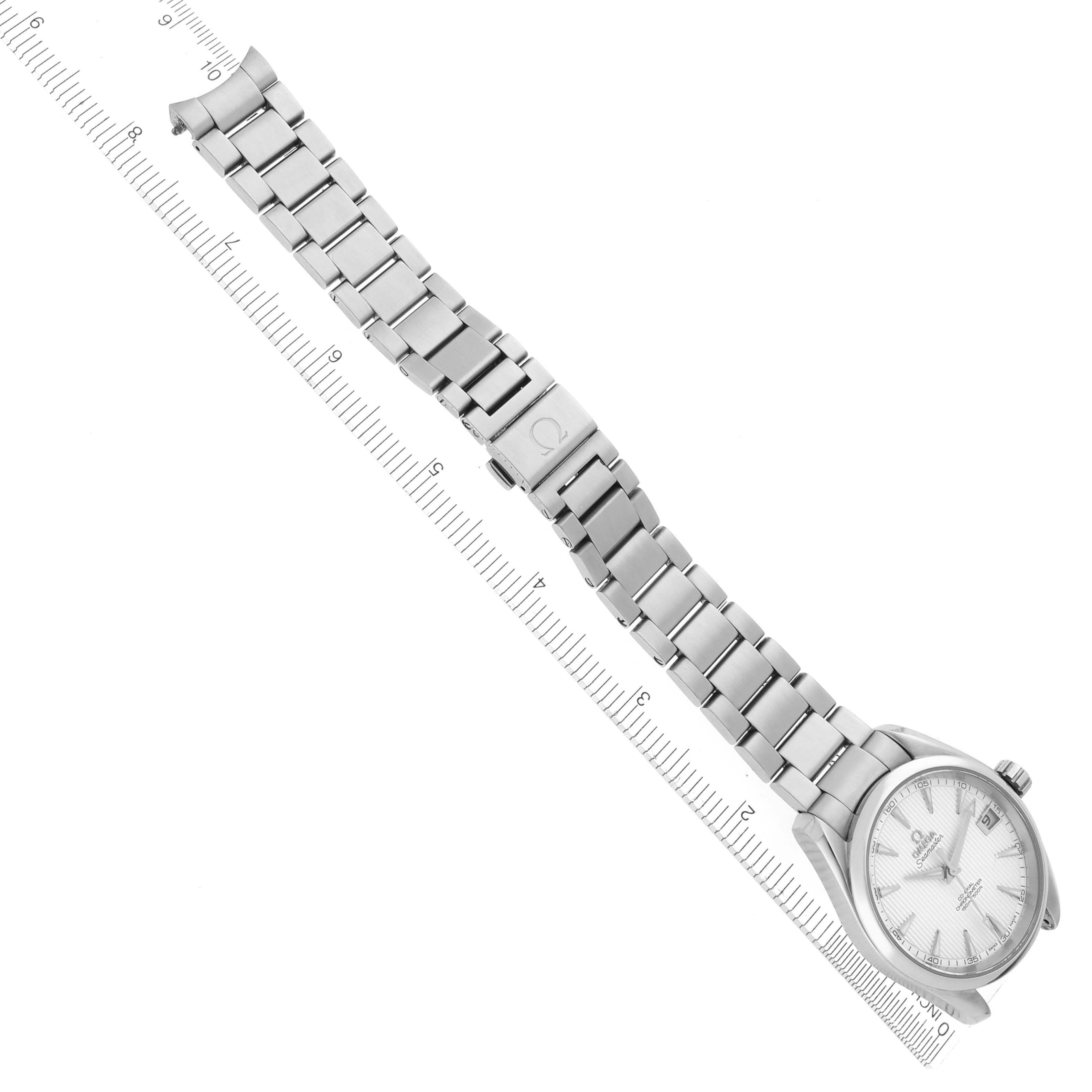 The Omega Aqua Terra 231.10.39.21.02.001 Men's Stainless Steel Silver Dial 231.10.39.21.02.001 Men's Stainless Steel Silver Dial watch is shown at a diagonal angle, displaying the dial, bracelet, clasp, and part of a ruler for scale.
