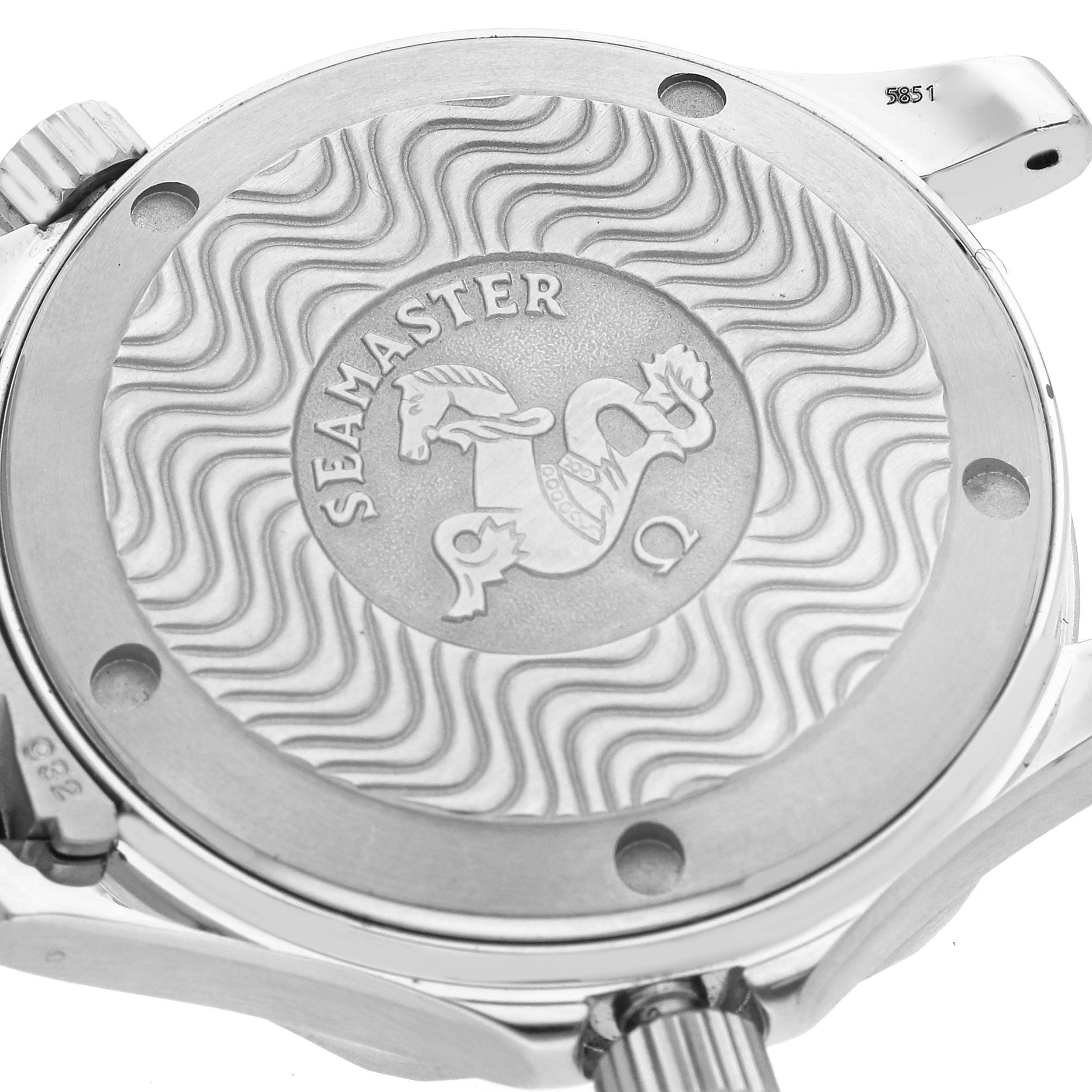 The image shows the back case of the Omega Seamaster 2263.80.00 Men
s Stainless Steel Blue Dial 2263.80.00 Men
s Stainless Steel Blue Dial watch, highlighted with its embossed logo and wave pattern design.