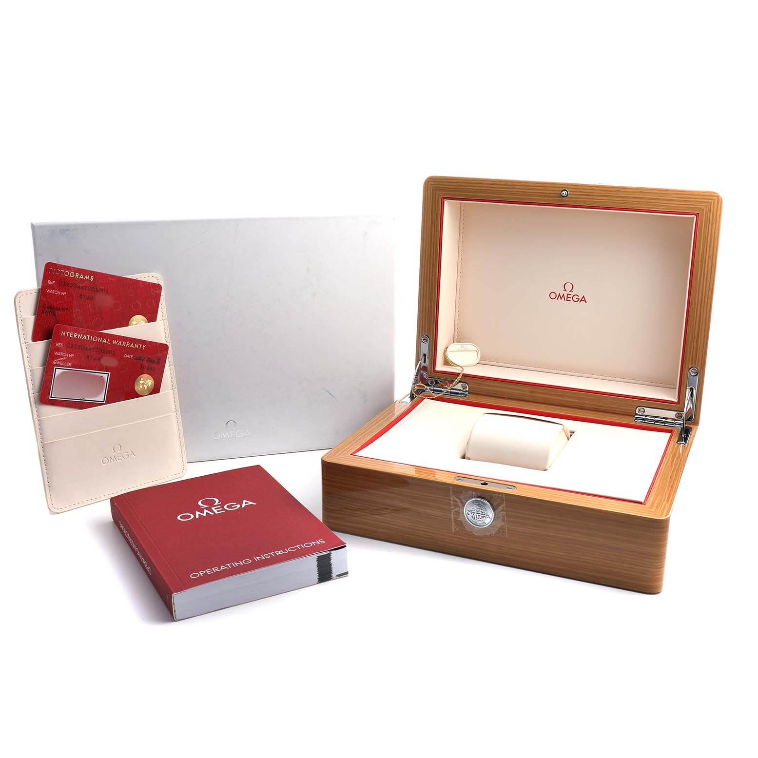 The image shows the Omega Planet Ocean 232.30.44.22.01.001 Men's Stainless Steel Black Dial watch box, warranty cards, and an operating manual at a front angle.