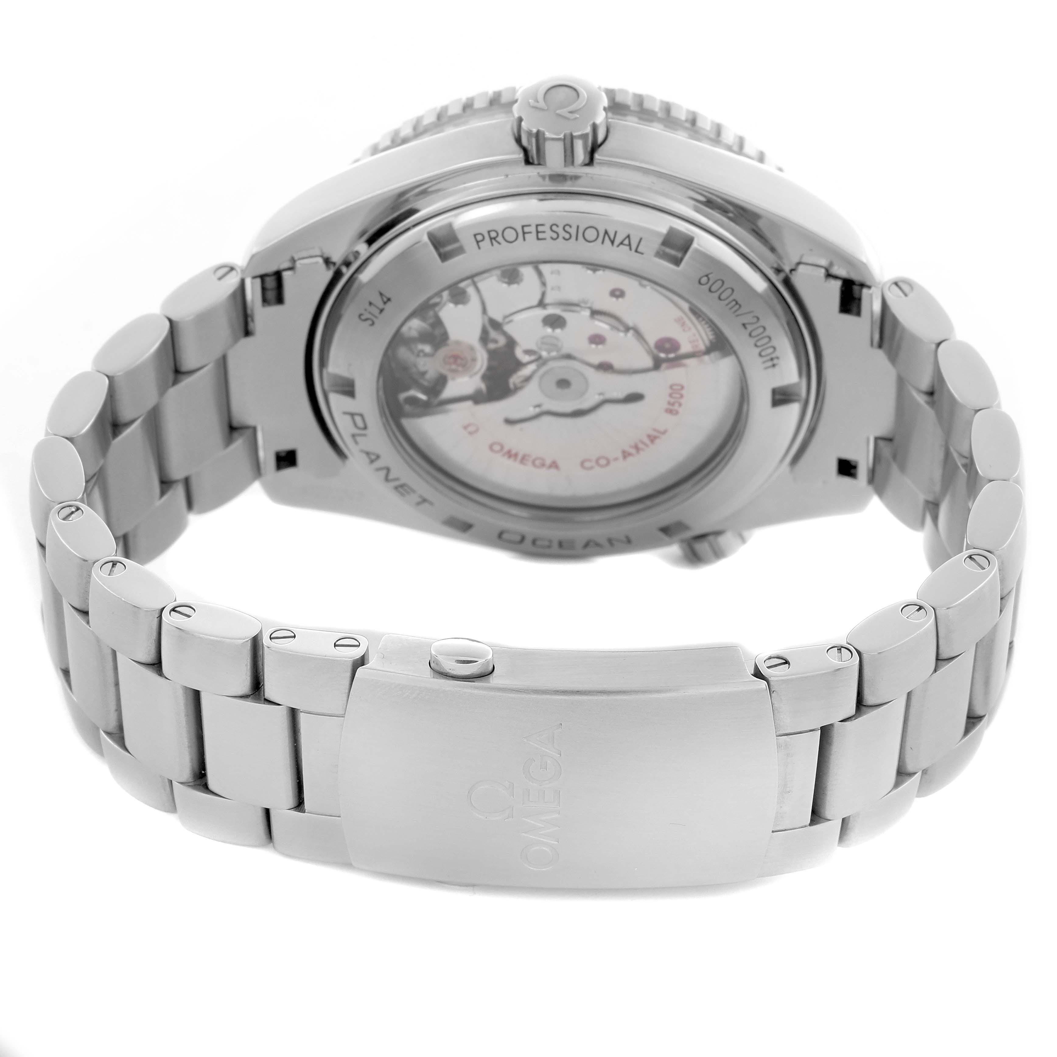 The image shows the back view of an Omega Planet Ocean 232.30.46.21.01.001 Men's Stainless Steel Black Dial 232.30.46.21.01.001 Men's Stainless Steel Black Dial, highlighting the transparent case back and stainless steel bracelet.