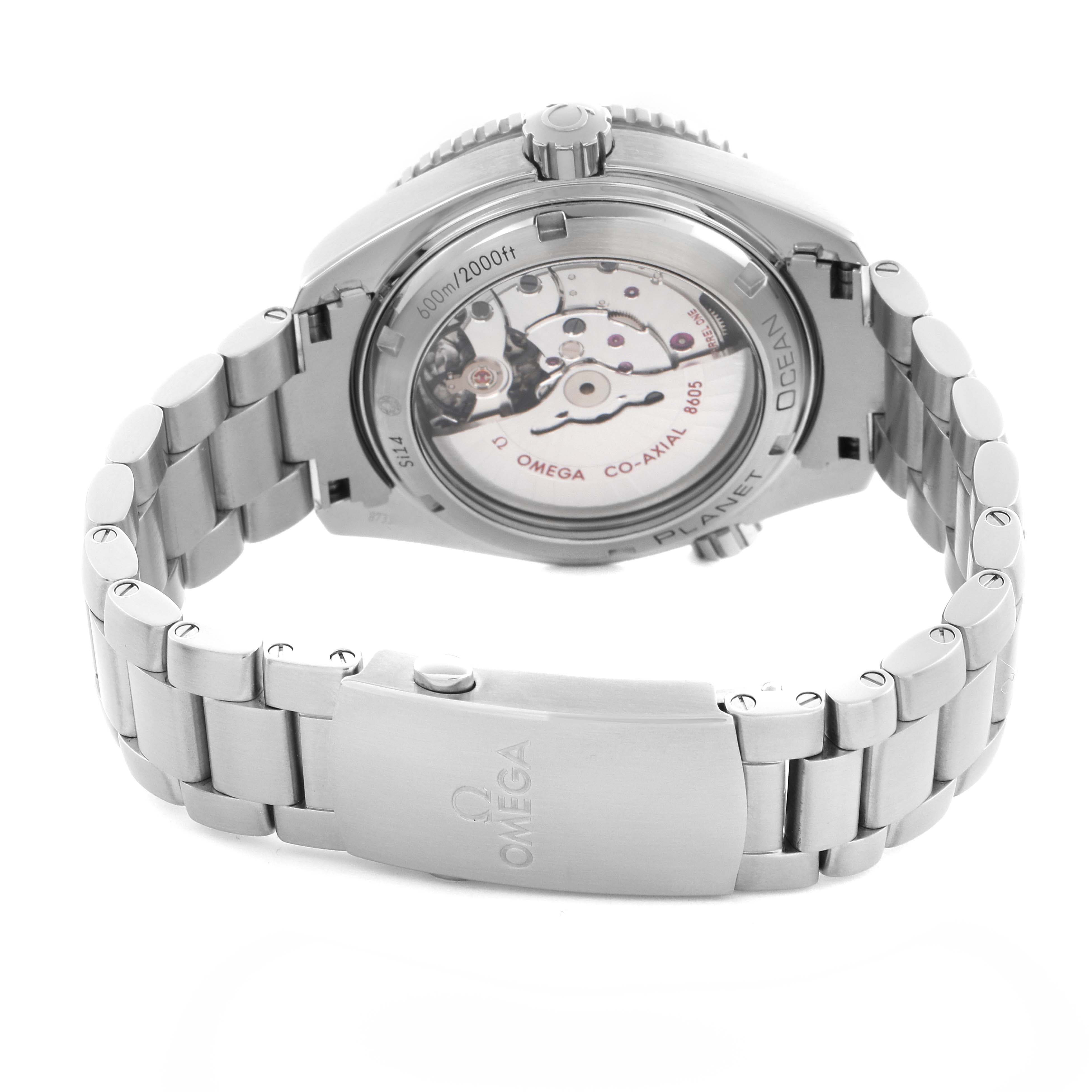 The Omega Planet Ocean 232.30.44.22.01.001 Men
s Stainless Steel Black Dial 232.30.44.22.01.001 Men
s Stainless Steel Black Dial watch is shown from the back, highlighting the transparent caseback and metal bracelet.