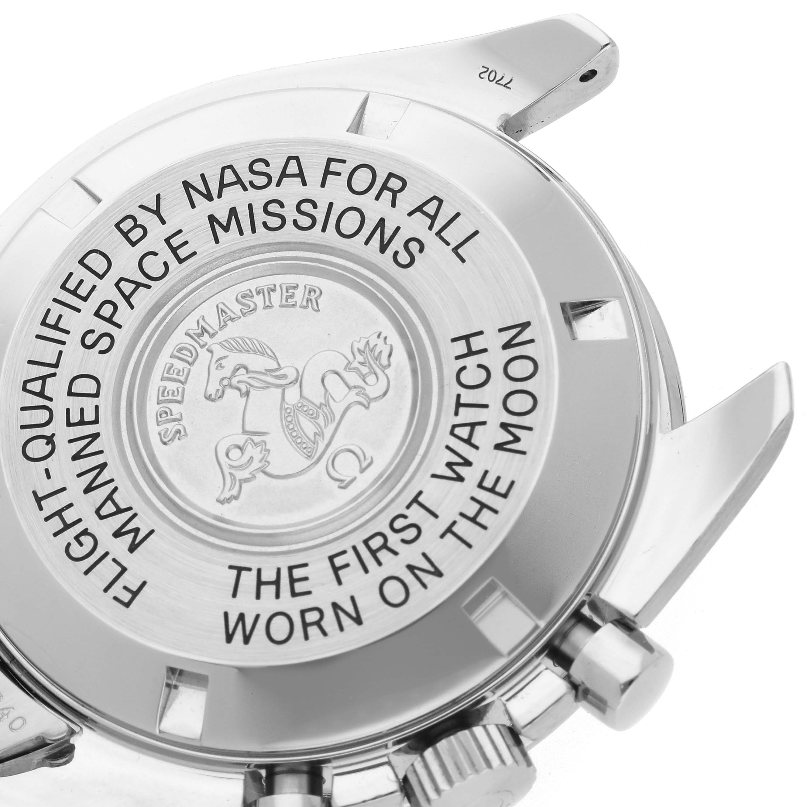 The image shows the case back of an Omega Speedmaster 3570.50.00 Men's Stainless Steel Black Dial 3570.50.00 Men's Stainless Steel Black Dial, highlighting its engraved medallion and text.