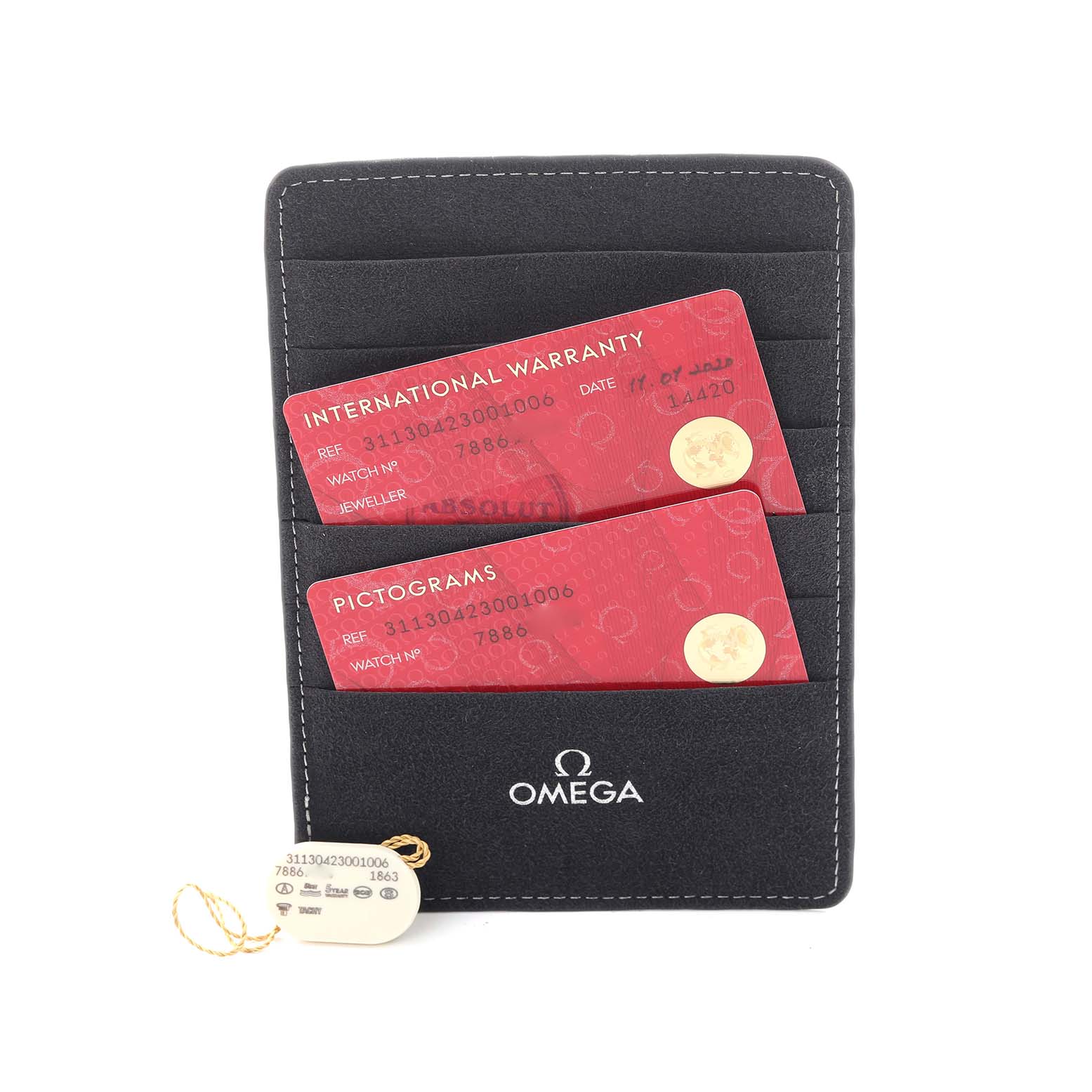 The image shows an Omega Speedmaster 311.30.42.30.01.006 Men's Stainless Steel Black Dial 311.30.42.30.01.006 Men's Stainless Steel Black Dial's International Warranty and Pictograms cards in a black holder with a tag attached.