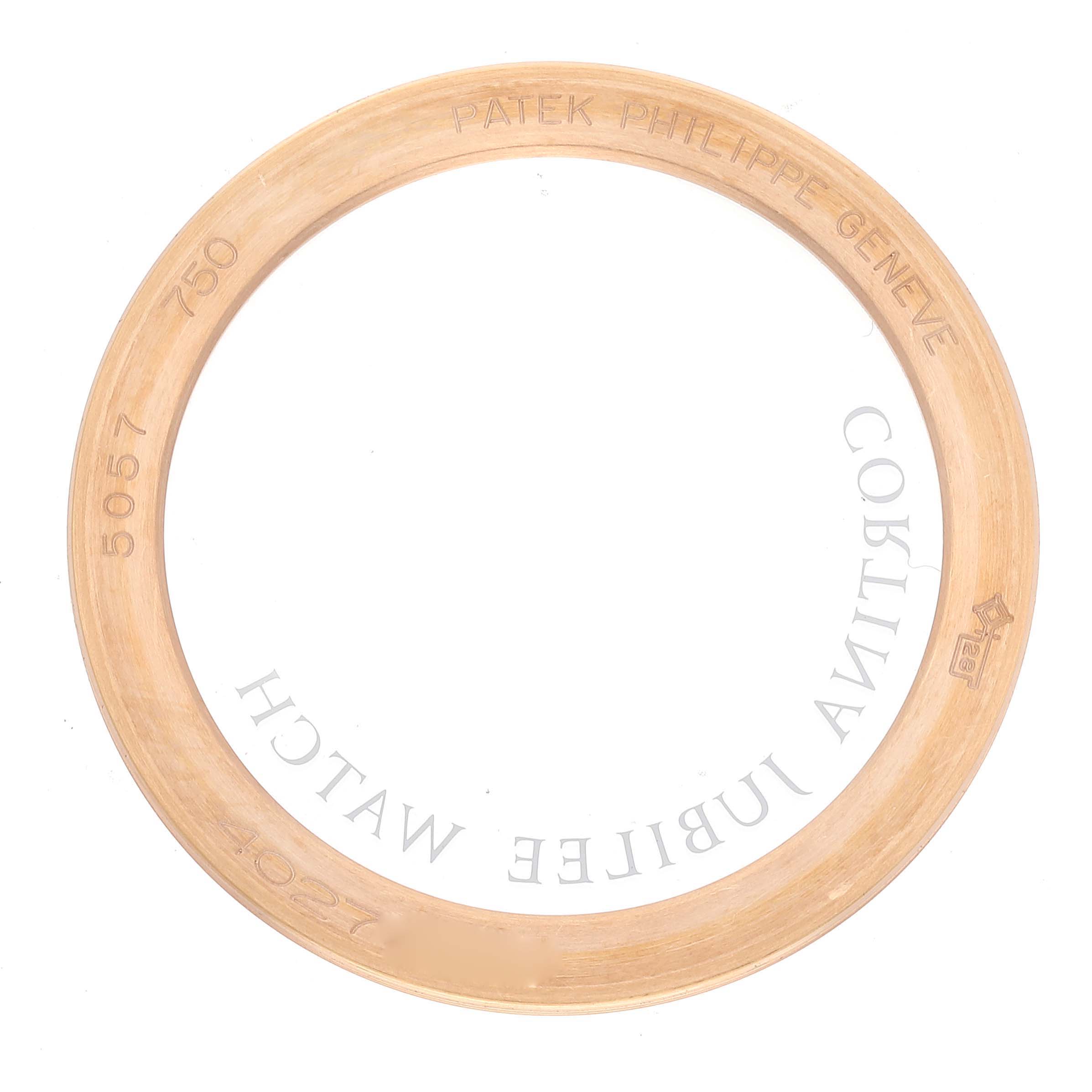 This image shows the bezel or ring of a Patek Philippe Calatrava 5057R Men's Rose Gold White Dial 5057R Men's Rose Gold White Dial watch, highlighting inscriptions and hallmarks.
