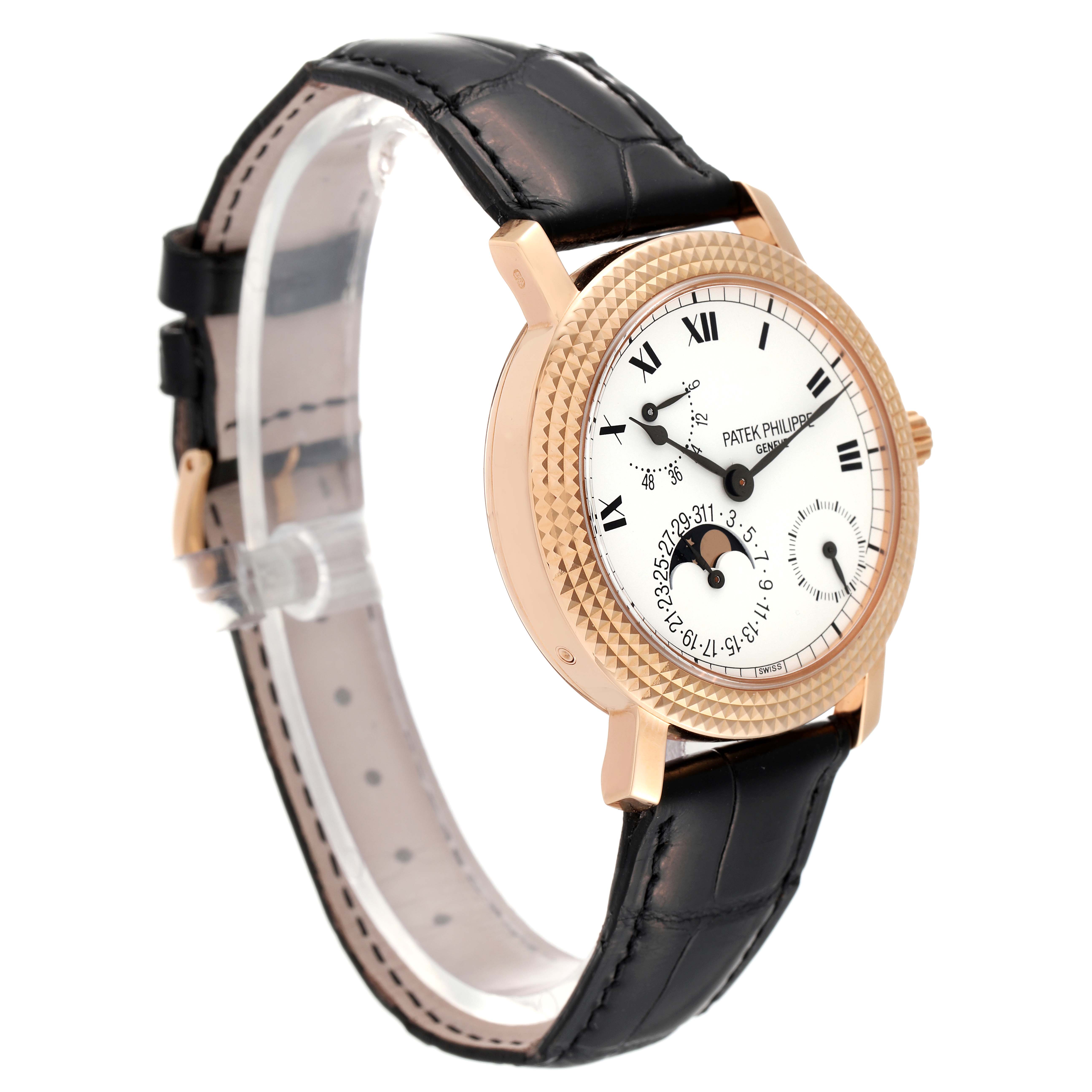 This Patek Philippe Calatrava 5057R Men's Rose Gold White Dial 5057R Men's Rose Gold White Dial watch is shown at a three-quarter angle, highlighting its dial, bezel, and leather strap.