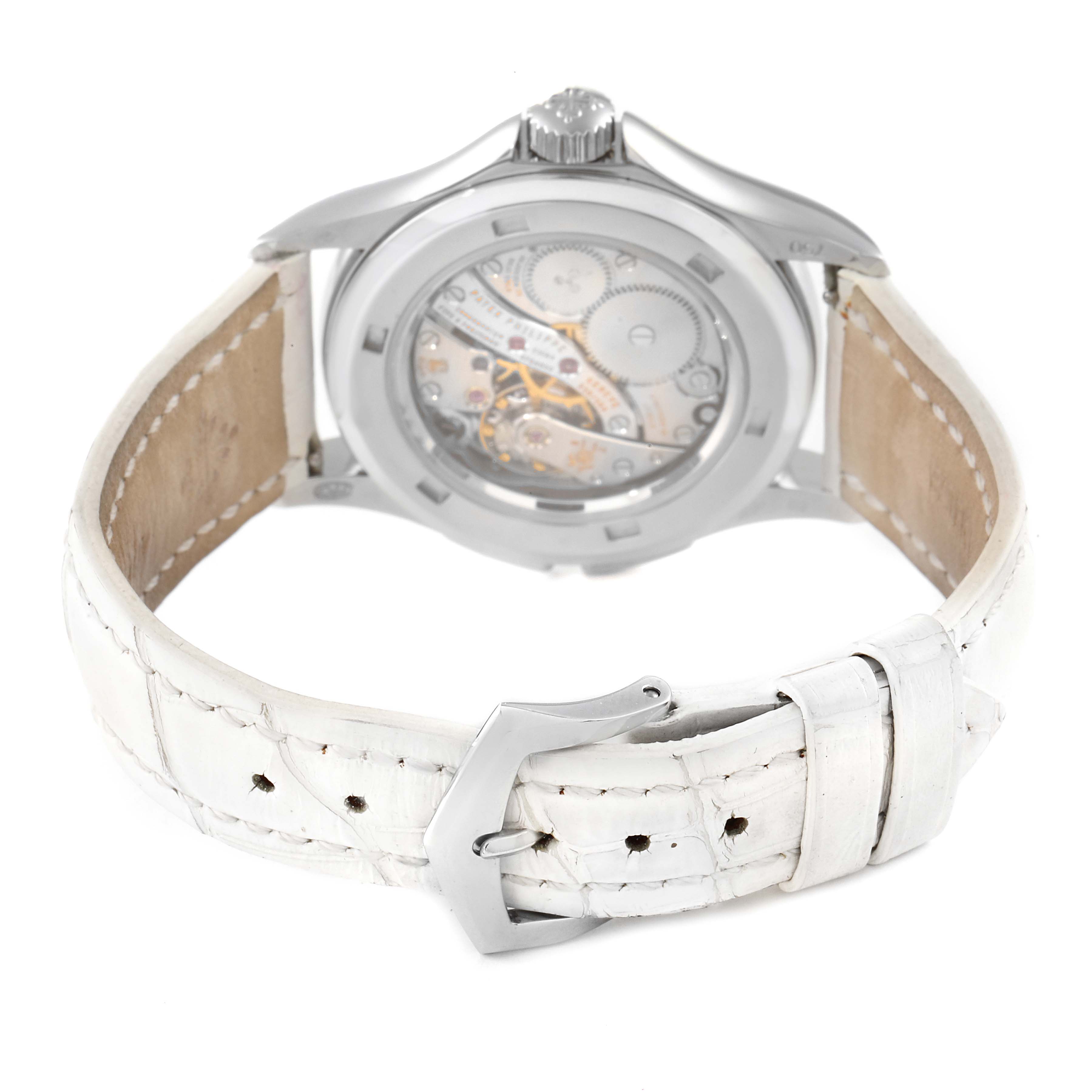 The image shows the back view of a Patek Philippe Calatrava 4934G Women
s White Gold Mother of Pearl Dial 4934G Women
s White Gold Mother of Pearl Dial watch, highlighting its transparent case back and white leather strap.