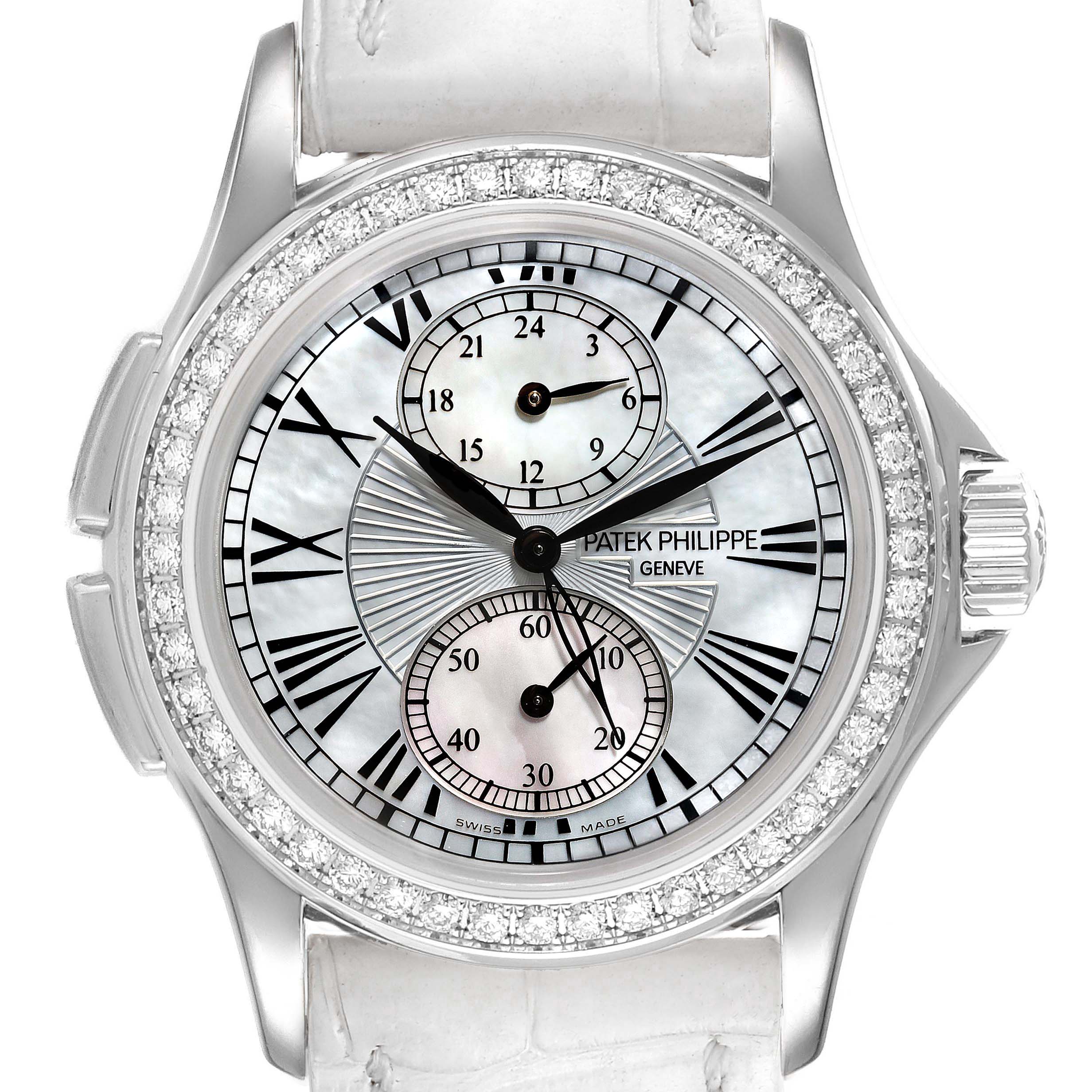 This image shows a frontal view of a Patek Philippe Calatrava 4934G Women
s White Gold Mother of Pearl Dial 4934G Women
s White Gold Mother of Pearl Dial watch with a decorated dial and a diamond bezel.