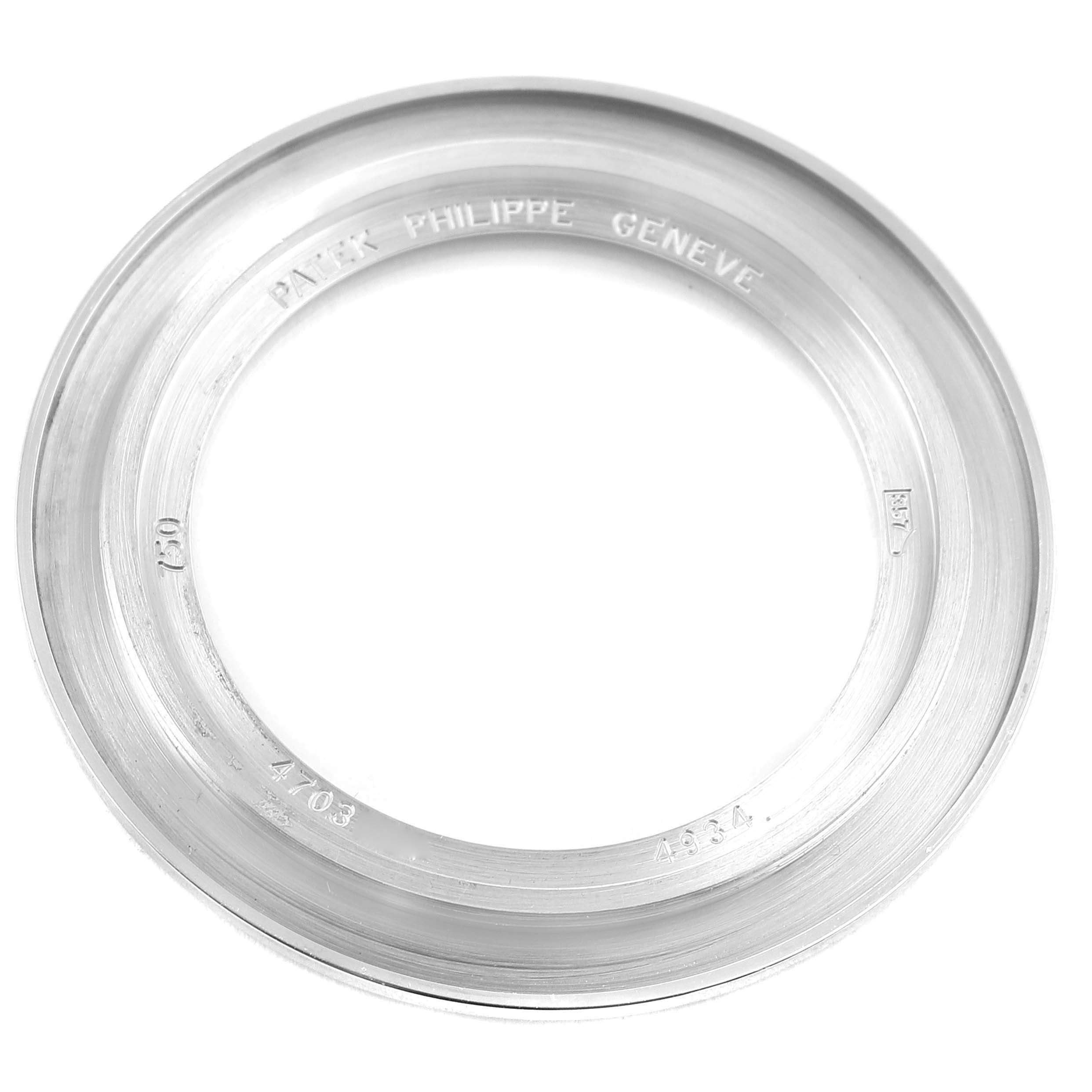 This image shows the bezel of a Patek Philippe Calatrava 4934G Women
s White Gold Mother of Pearl Dial 4934G Women
s White Gold Mother of Pearl Dial watch viewed from above.