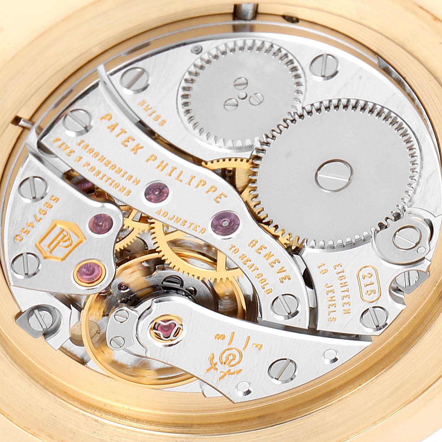This image shows the movement mechanism and internal gears of a Patek Philippe Calatrava 5119J Men's Yellow Gold White Dial 5119J Men's Yellow Gold White Dial watch viewed from the back.