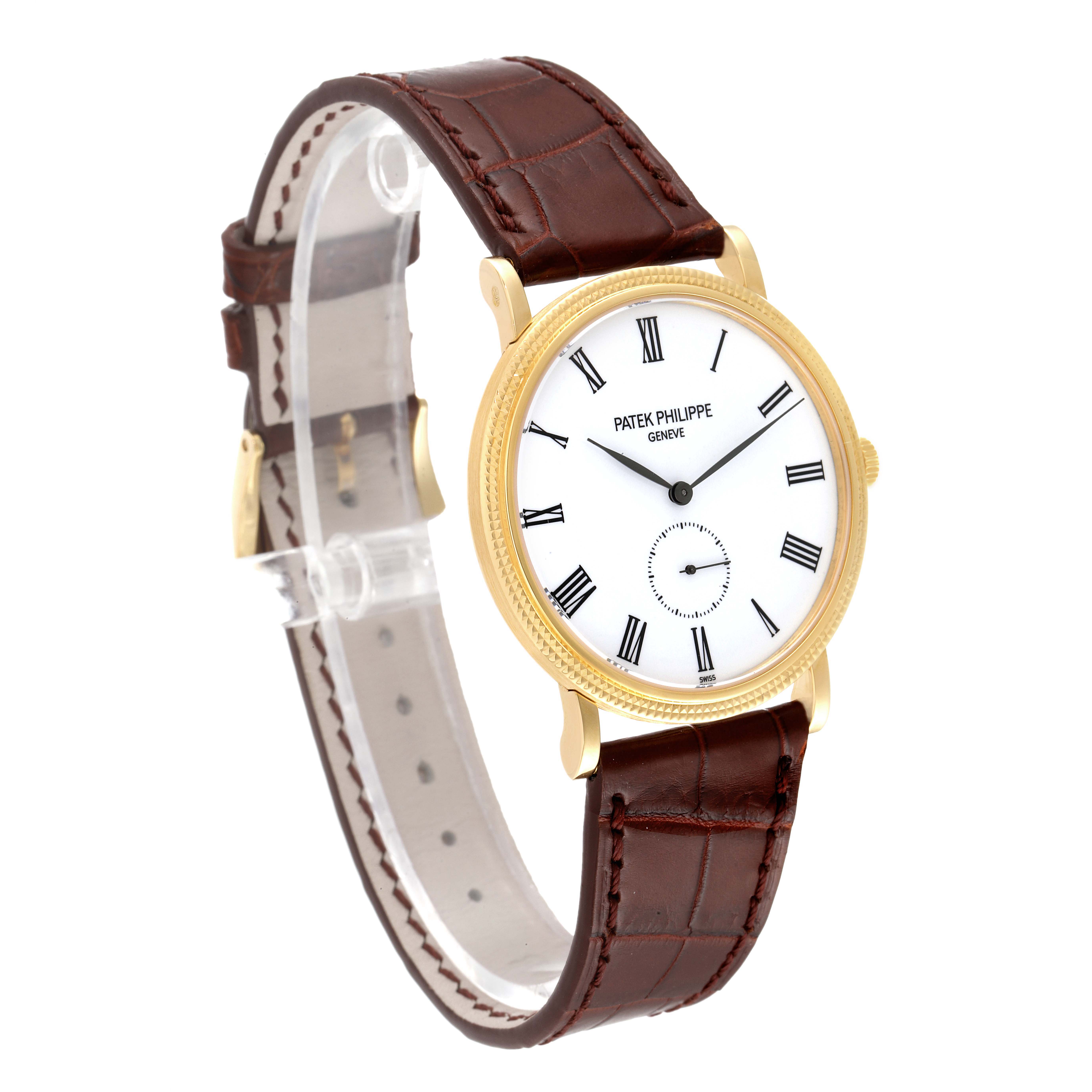 This image shows a side angle of the Patek Philippe Calatrava 5119J Men's Yellow Gold White Dial 5119J Men's Yellow Gold White Dial watch, highlighting its brown leather strap and white dial.