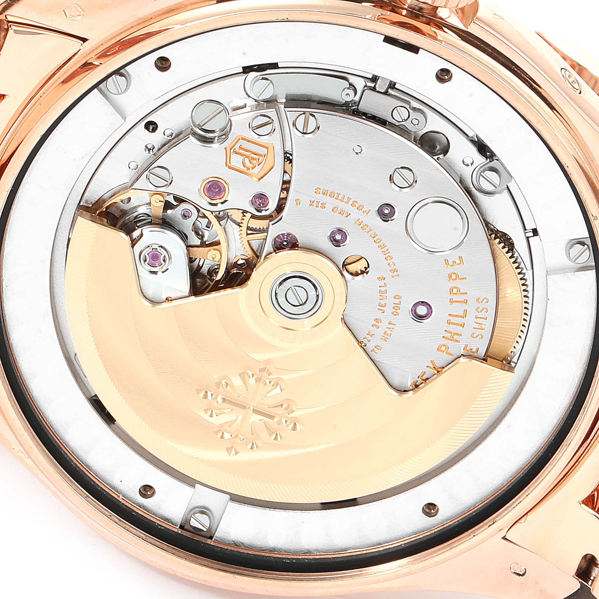The image displays the back view of the Patek Philippe 5146R Men's Rose Gold Beige Dial 5146R Men's Rose Gold Beige Dial Complicated Annual Calendar Rose Gold Watch 5146, showcasing its mechanism.