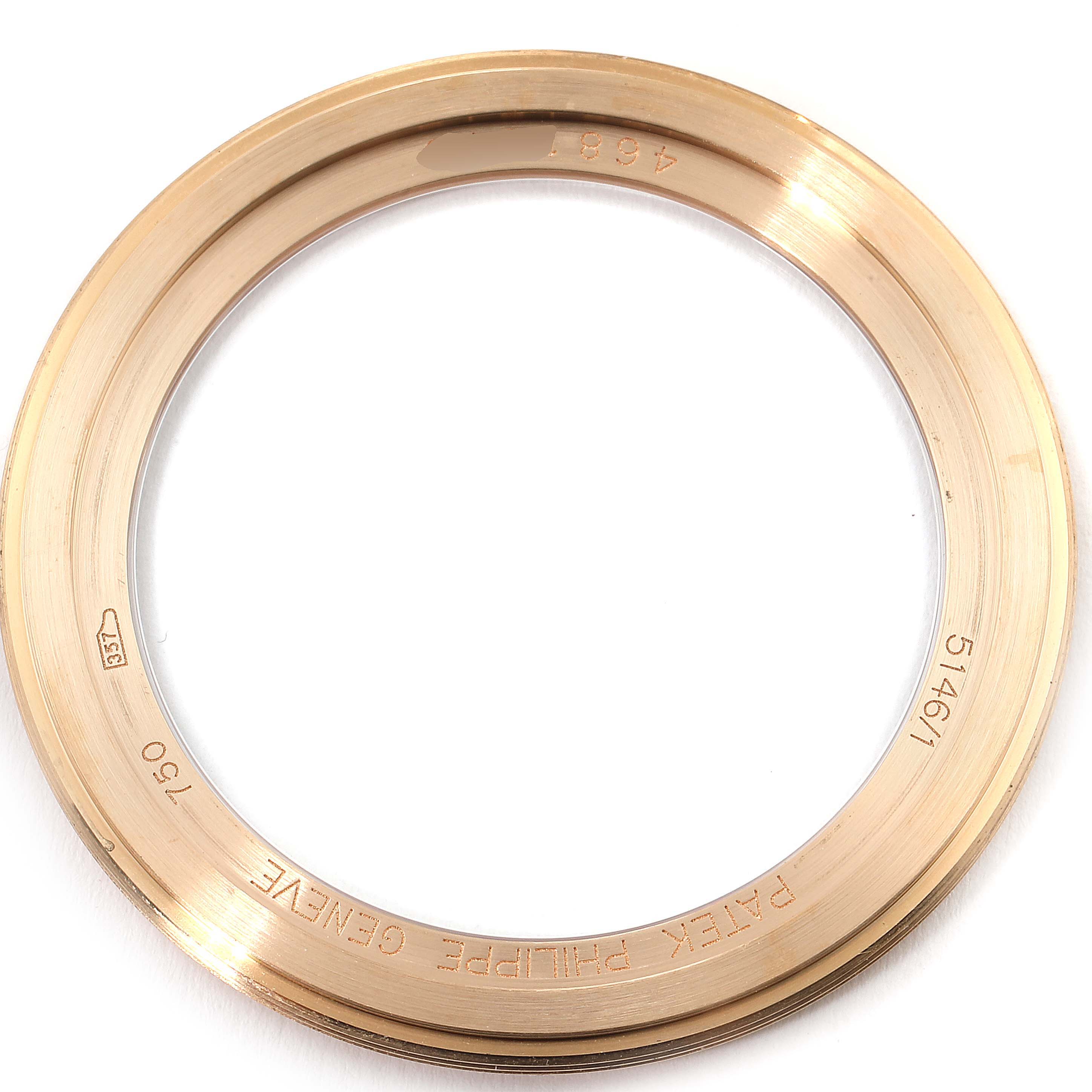 The image shows the rose gold bezel from a Patek Philippe 5146R Men's Rose Gold Beige Dial 5146R Men's Rose Gold Beige Dial Complicated Annual Calendar 5146 watch, viewed from above.