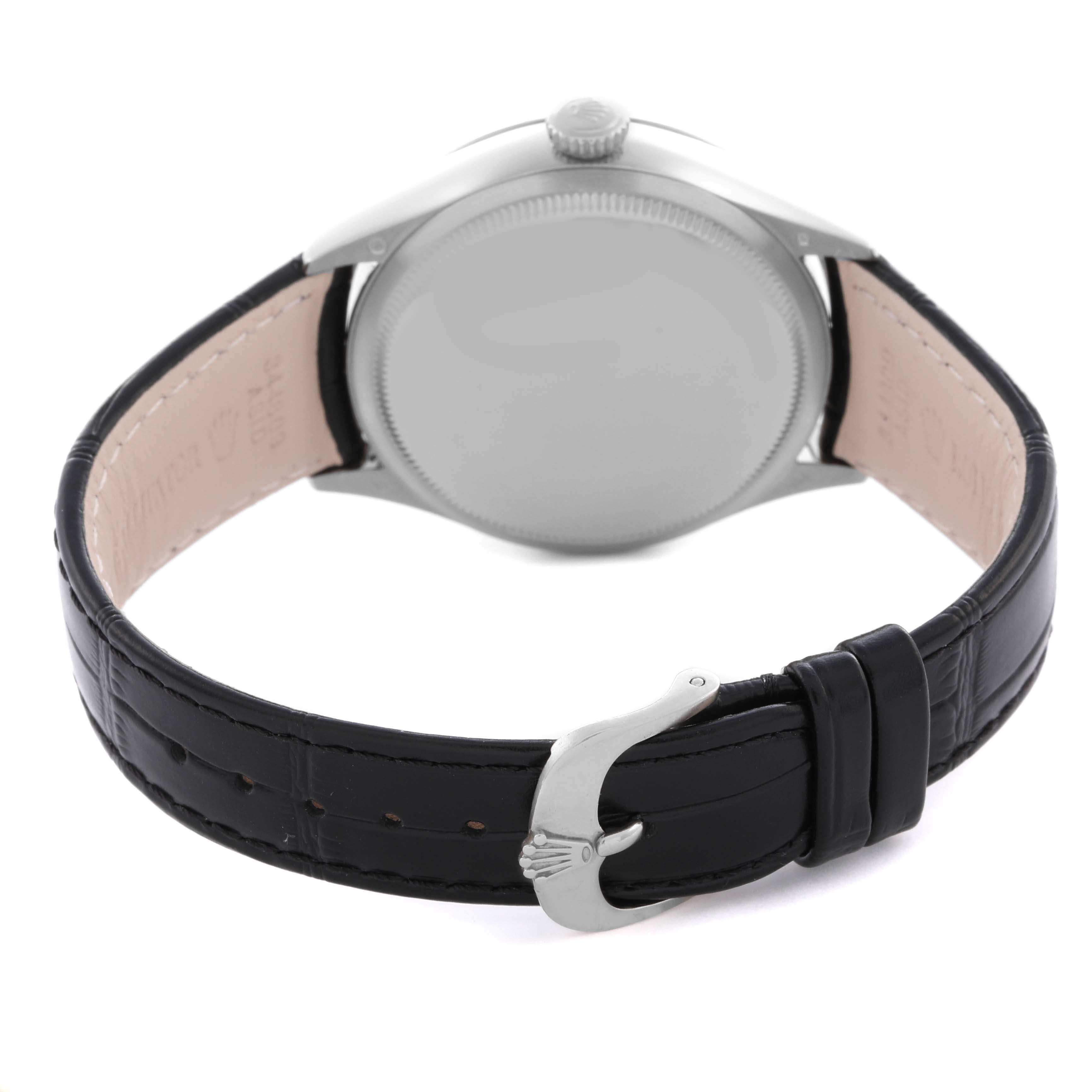 The Rolex Cellini 50529 Men's White Gold Black Dial 50529 Men's White Gold Black Dial watch is shown from the back, highlighting its case, crown, and black leather strap with buckle.