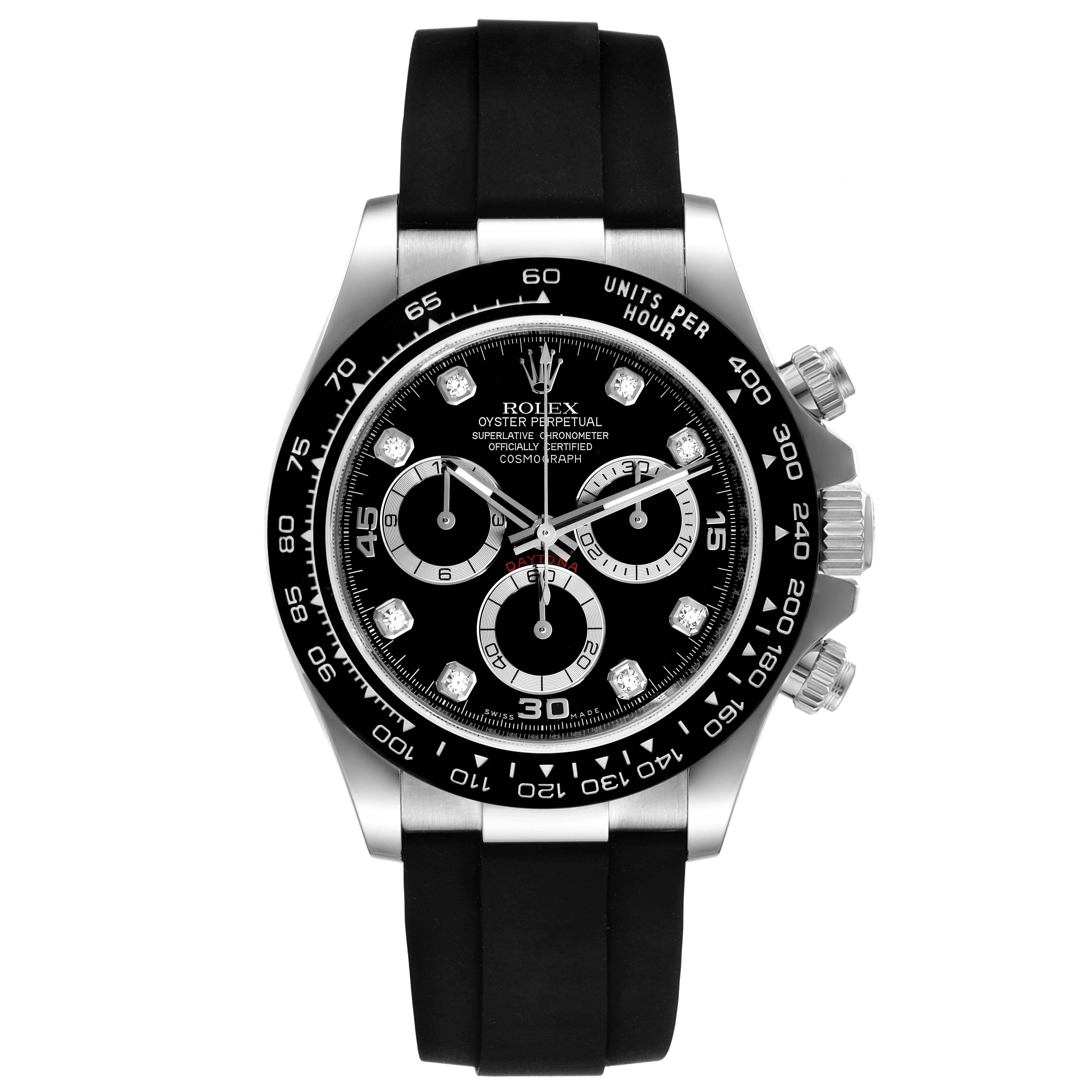 The image shows a front view of a Rolex Daytona 116519 Men
s White Gold Black Dial 116519 Men
s White Gold Black Dial watch with a black dial, tachymeter bezel, and a black rubber strap.