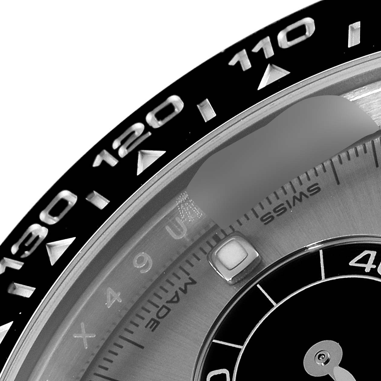 The image shows a close-up of the bezel, part of the dial, and the "Swiss Made" marking of a Rolex Daytona 116519 Men's White Gold Grey Dial 116519 Men's White Gold Grey Dial watch.