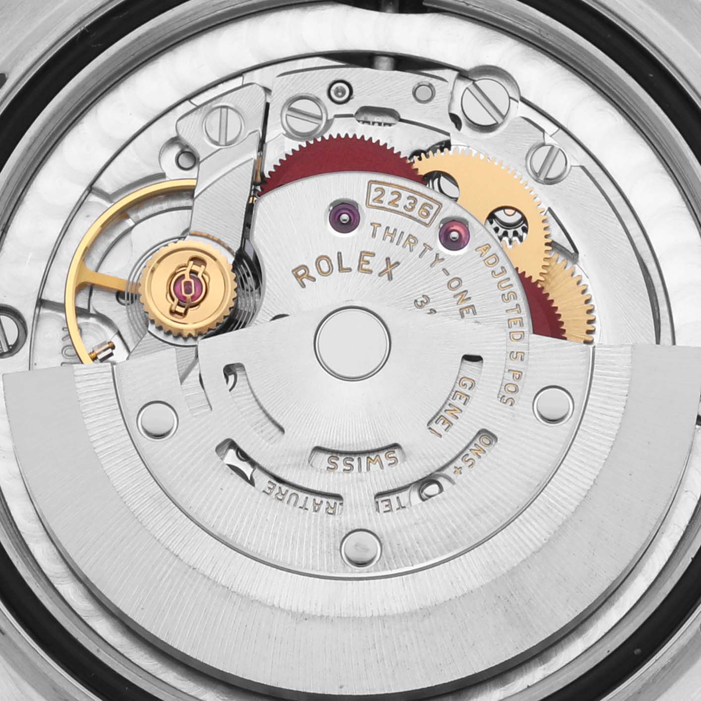 The image shows the movement mechanism of a Rolex Mid-Size 278381 Women's Steel and Gold (two tone) Pink Dial 278381 Women's Steel and Gold (two tone) Pink Dial watch, highlighting the gears and intricate parts from a top-down angle.