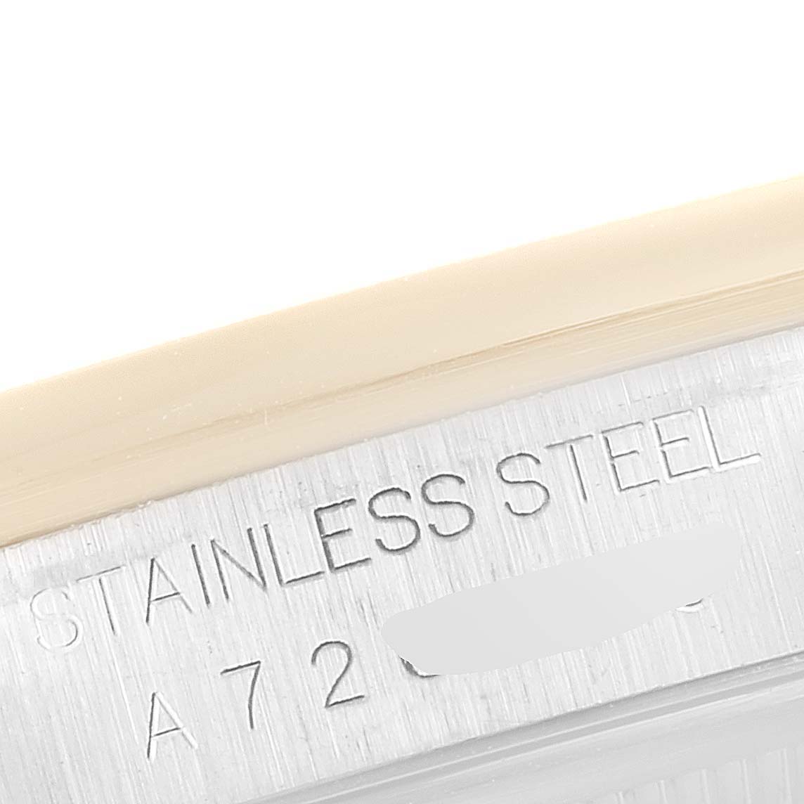 The image shows a close-up of the stainless steel case back with engraved text of a Rolex Datejust 16203 Men's Steel and Gold (two tone) Grey Dial 16203 Men's Steel and Gold (two tone) Grey Dial watch.