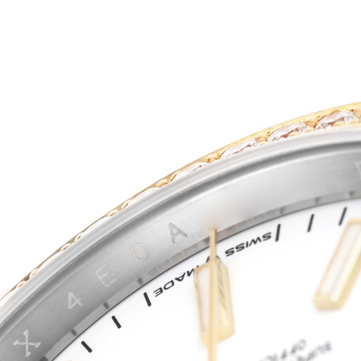 The image shows a partial close-up of the dial, bezel, and minute hand of a Rolex Datejust 126283 Men's Steel and Gold (two tone) White Dial watch.