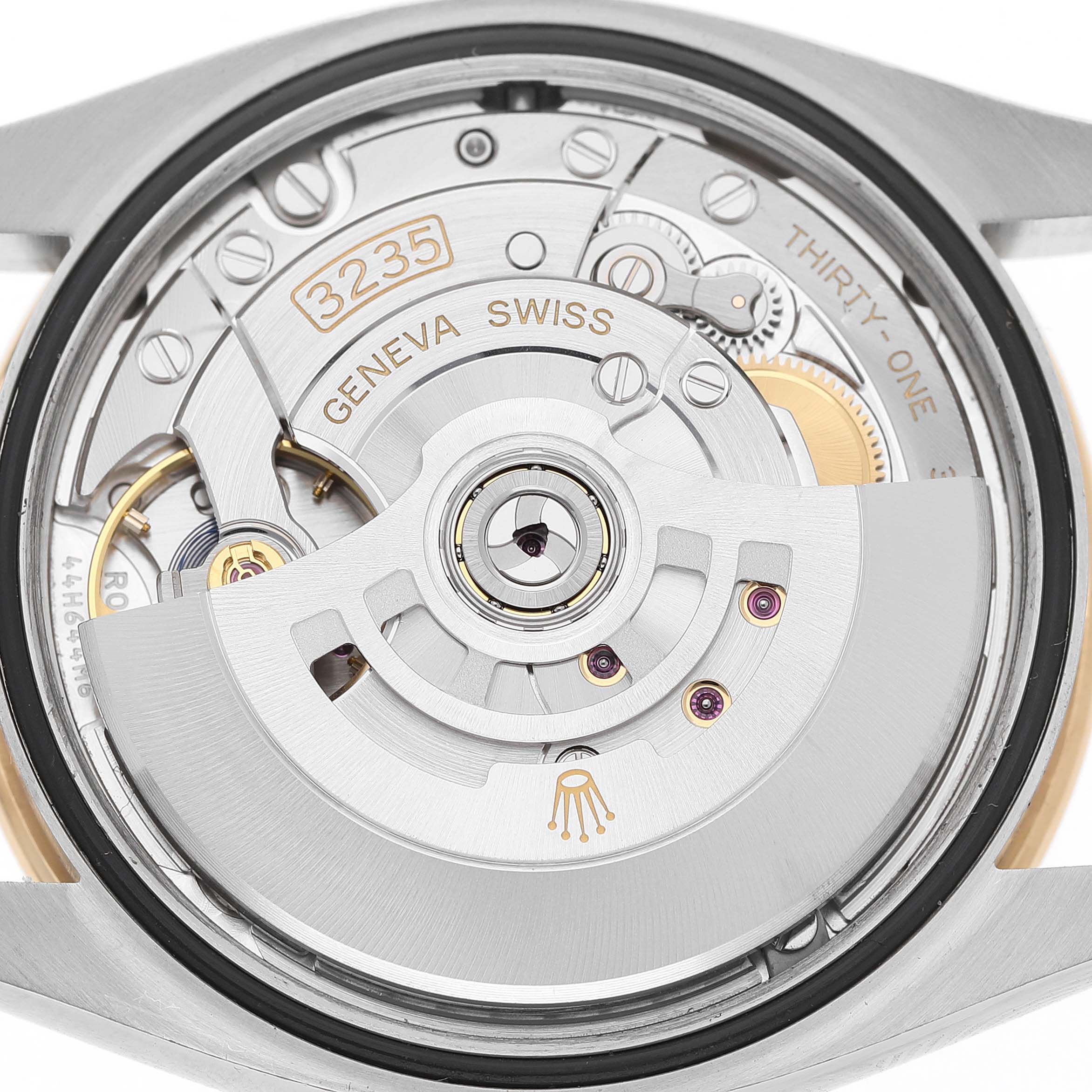 The image shows the movement from the back of a Rolex Datejust 126283 Men's Steel and Gold (two tone) White Dial watch, highlighting the rotor and intricate internal components.