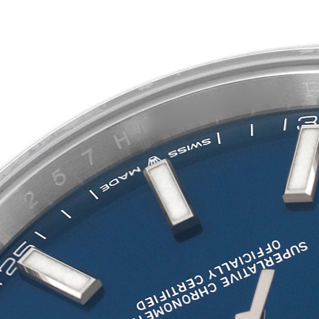 This image shows a close-up of part of the dial and bezel of a Rolex Datejust 41 126300 Men's Stainless Steel Blue Dial 126300 Men's Stainless Steel Blue Dial watch.