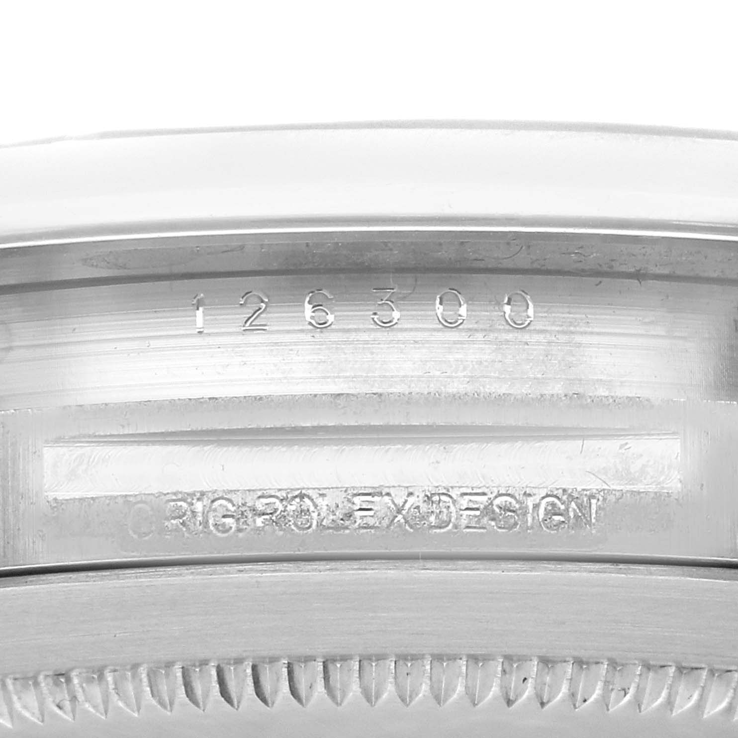 This image shows a close-up of the model number and "Orig Rolex Design" engraving on the case of a Rolex Datejust 41 126300 Men's Stainless Steel Blue Dial 126300 Men's Stainless Steel Blue Dial watch.