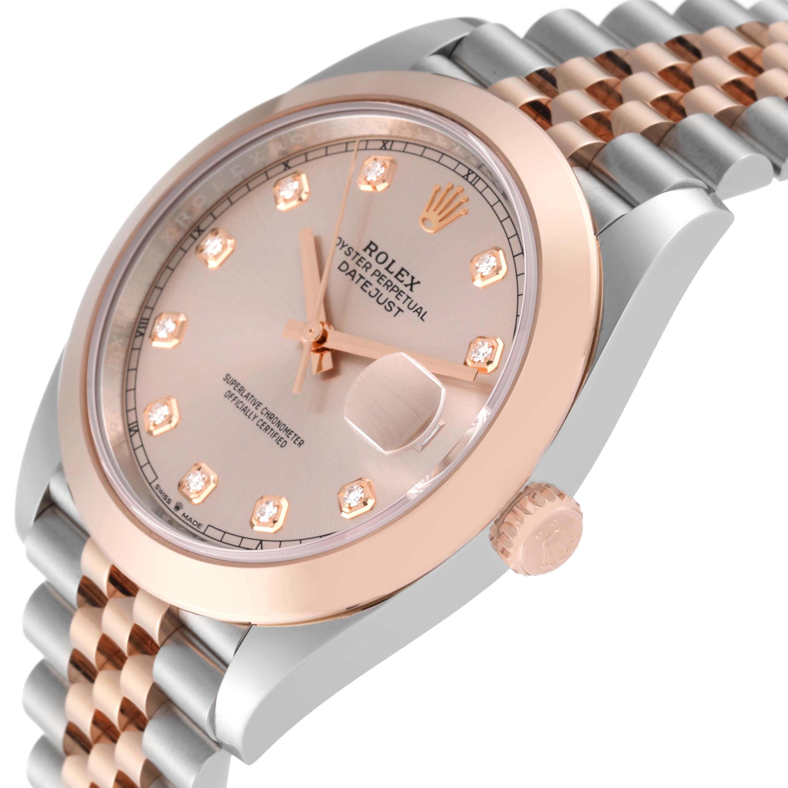 The image shows a close-up, angled view of the Rolex Datejust 41 126301 Men
s Steel and Gold (two tone) Pink Dial 126301 Men
s Steel and Gold (two tone) Pink Dial watch, highlighting the watch face and part of the bracelet.