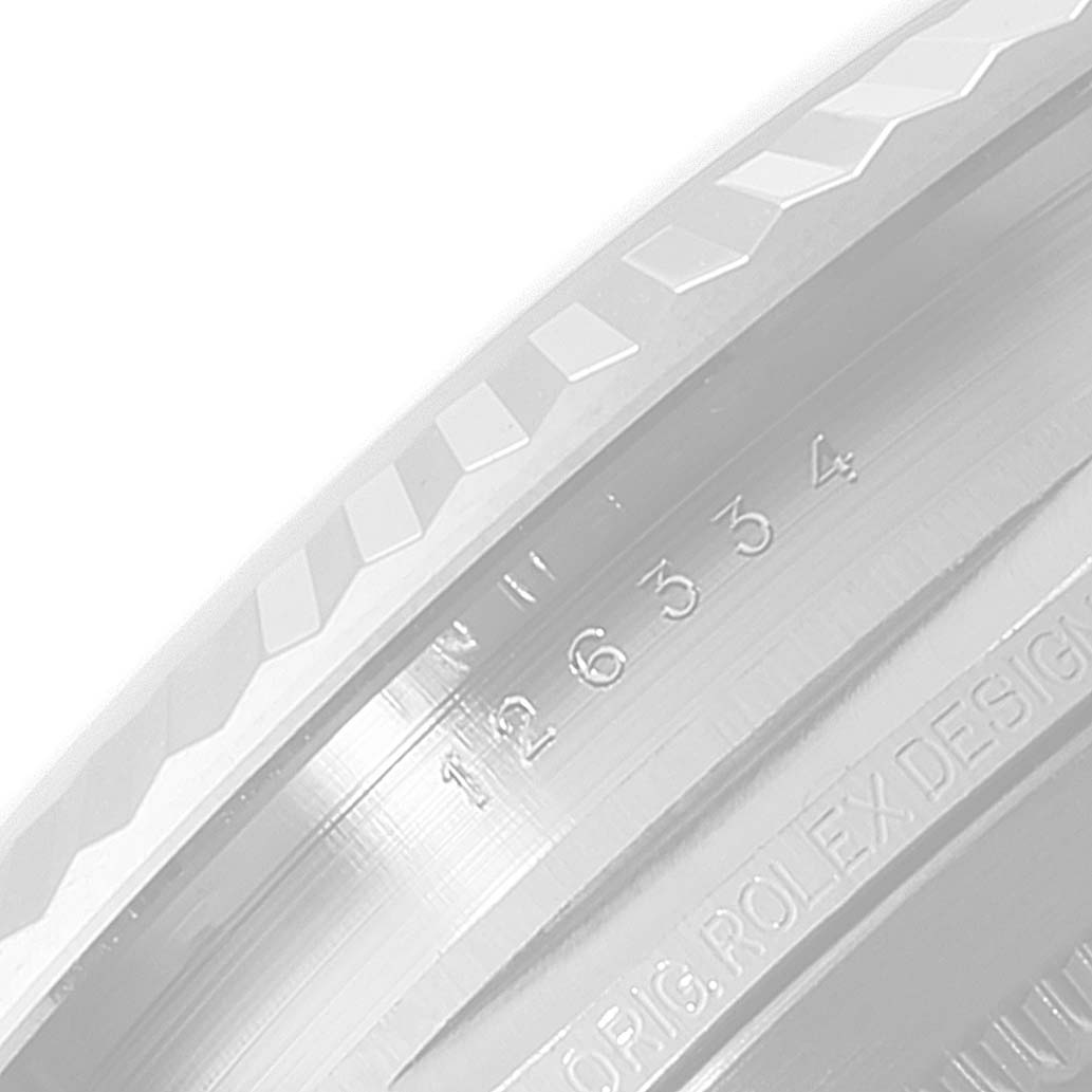 This close-up image shows the inner and outer engraved details on the bezel of the Rolex Datejust 41 126334 Men
s Stainless Steel Blue Dial 126334 Men
s Stainless Steel Blue Dial watch.
