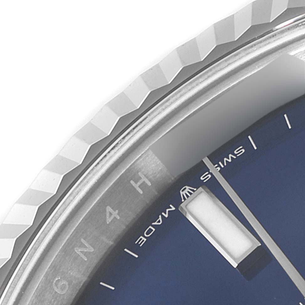 The image shows the bezel and part of the dial of the Rolex Datejust 41 126334 Men
s Stainless Steel Blue Dial 126334 Men
s Stainless Steel Blue Dial, with the "SWISS MADE" marking visible.