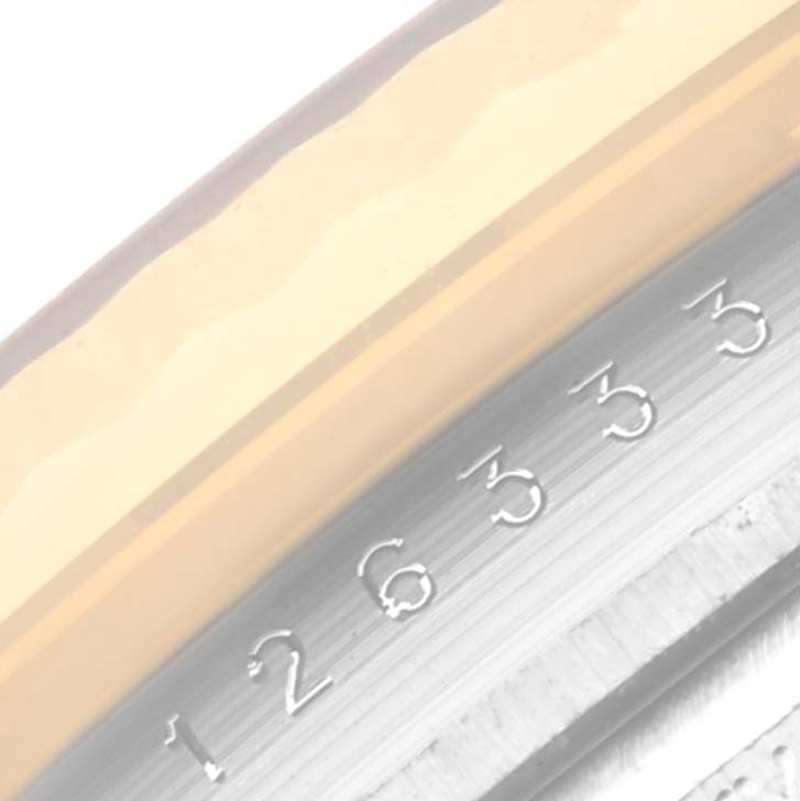 The image shows a close-up of the fluted bezel and the rehaut with serial number engravings on the Rolex Datejust 41 126333 Men's Steel and Gold (two tone) Grey Dial 126333 Men's Steel and Gold (two tone) Grey Dial.