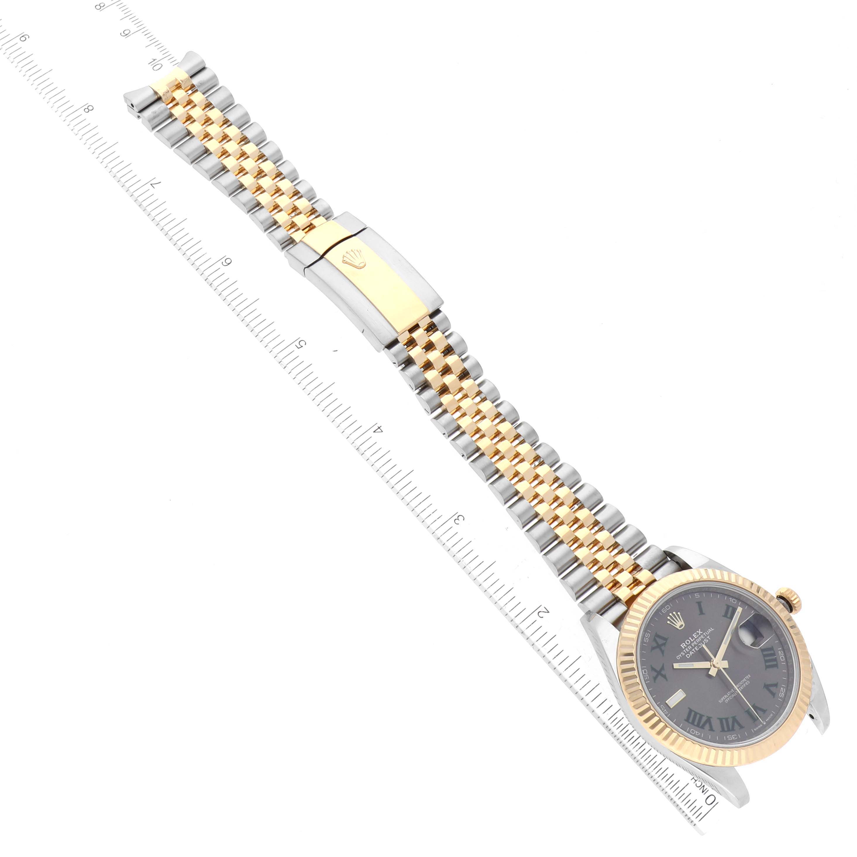 This Rolex Datejust 41 126333 Men's Steel and Gold (two tone) Grey Dial 126333 Men's Steel and Gold (two tone) Grey Dial watch is shown from a top-down angle, including the face, bezel, band, and clasp against a ruler for scale.