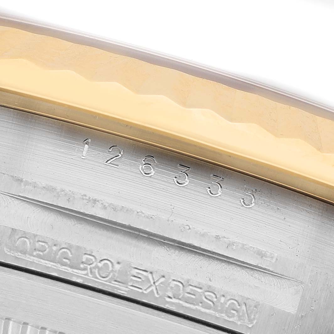 The image shows a close-up of the serial number engraving on the side of a Rolex Datejust 41 126333 Men's Steel and Gold (two tone) Grey Dial watch.