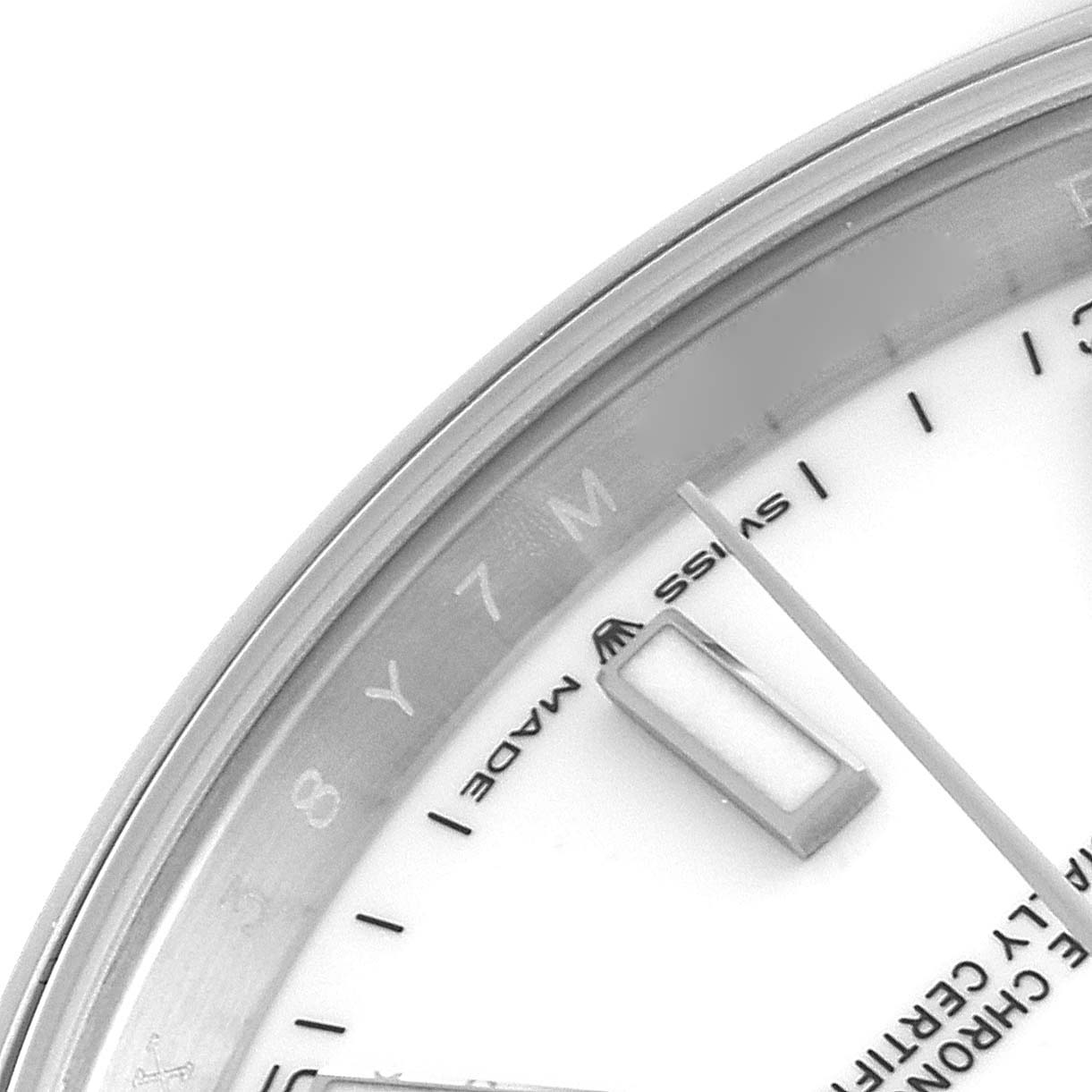 This close-up image of the Rolex Datejust 41 126300 Men
s Stainless Steel White Dial 126300 Men
s Stainless Steel White Dial watch shows the upper right portion of the dial, the "Swiss Made" text, and a segment of the case.