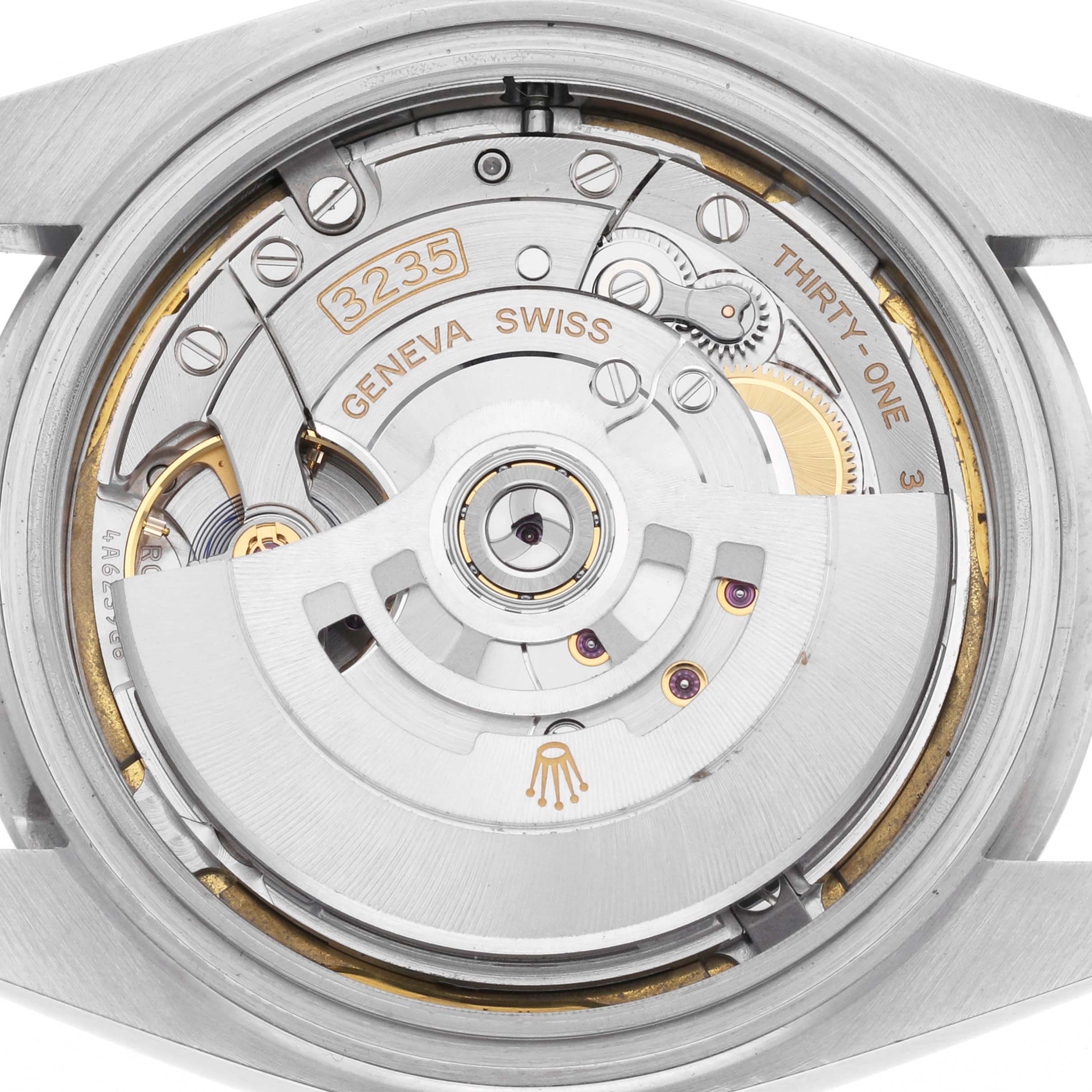 The image shows the movement of a Rolex Datejust 41 126300 Men's Stainless Steel White Dial 126300 Men's Stainless Steel White Dial, focusing on its intricate internal mechanics from the back.